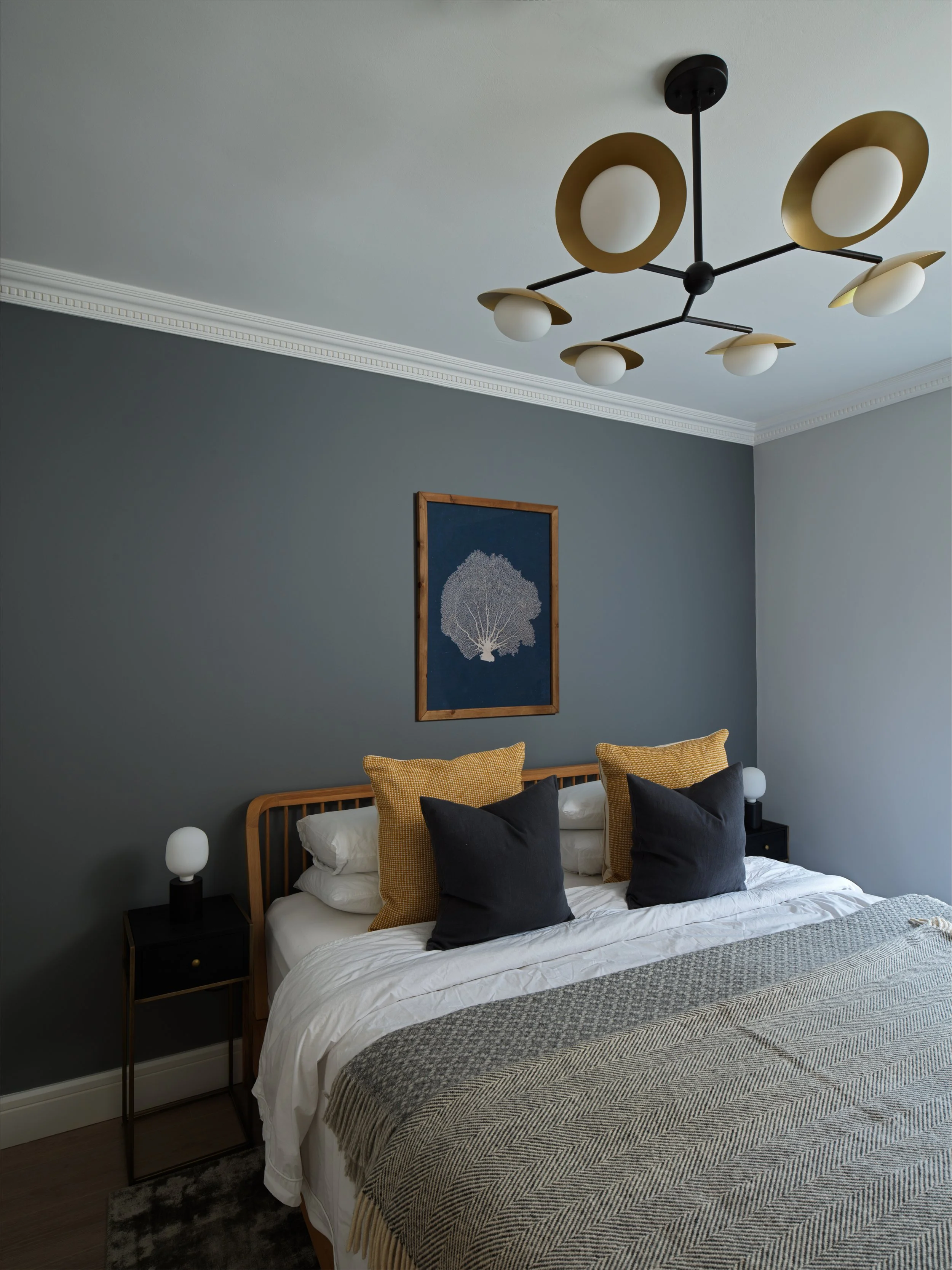 dark grey bedroom with striking 6 bulb ceiling light