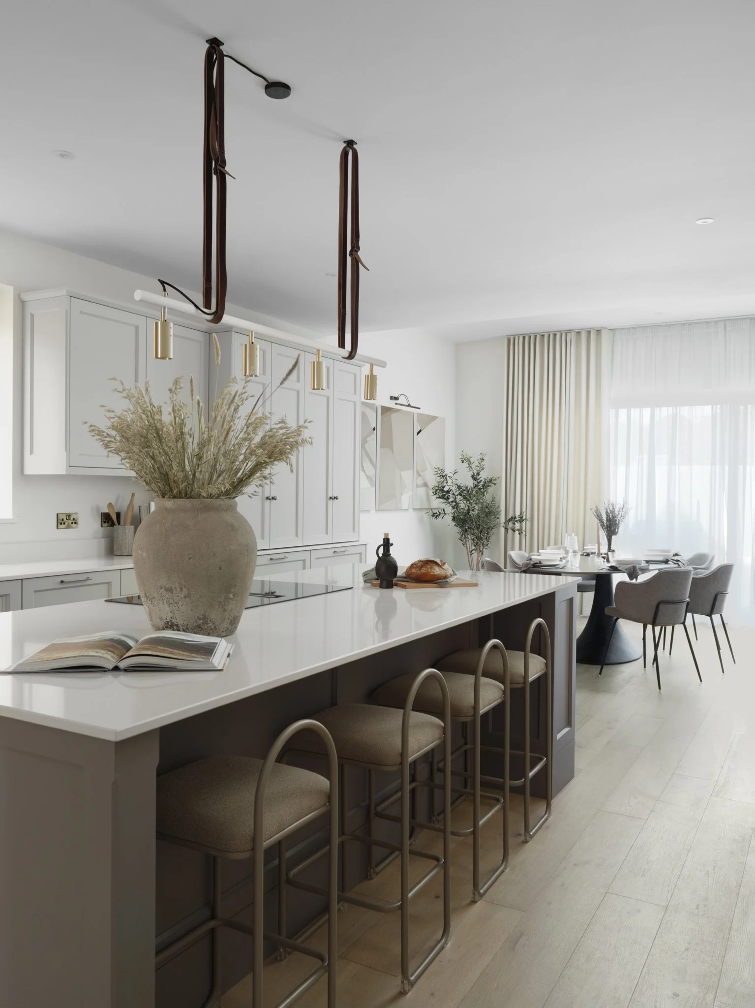 open plan kitchen dining area with oak floors