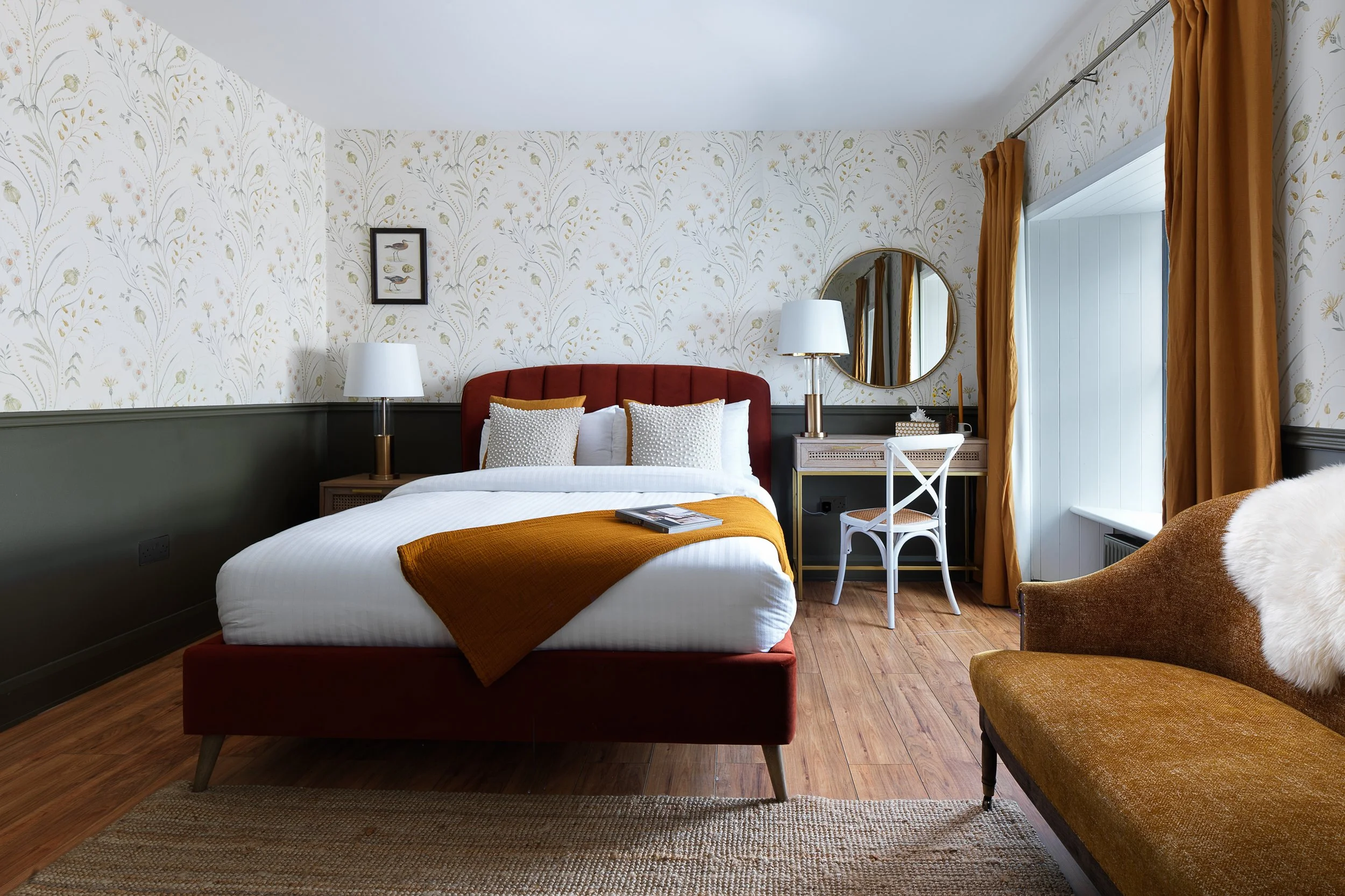 double room with red divan base and yellow sofa