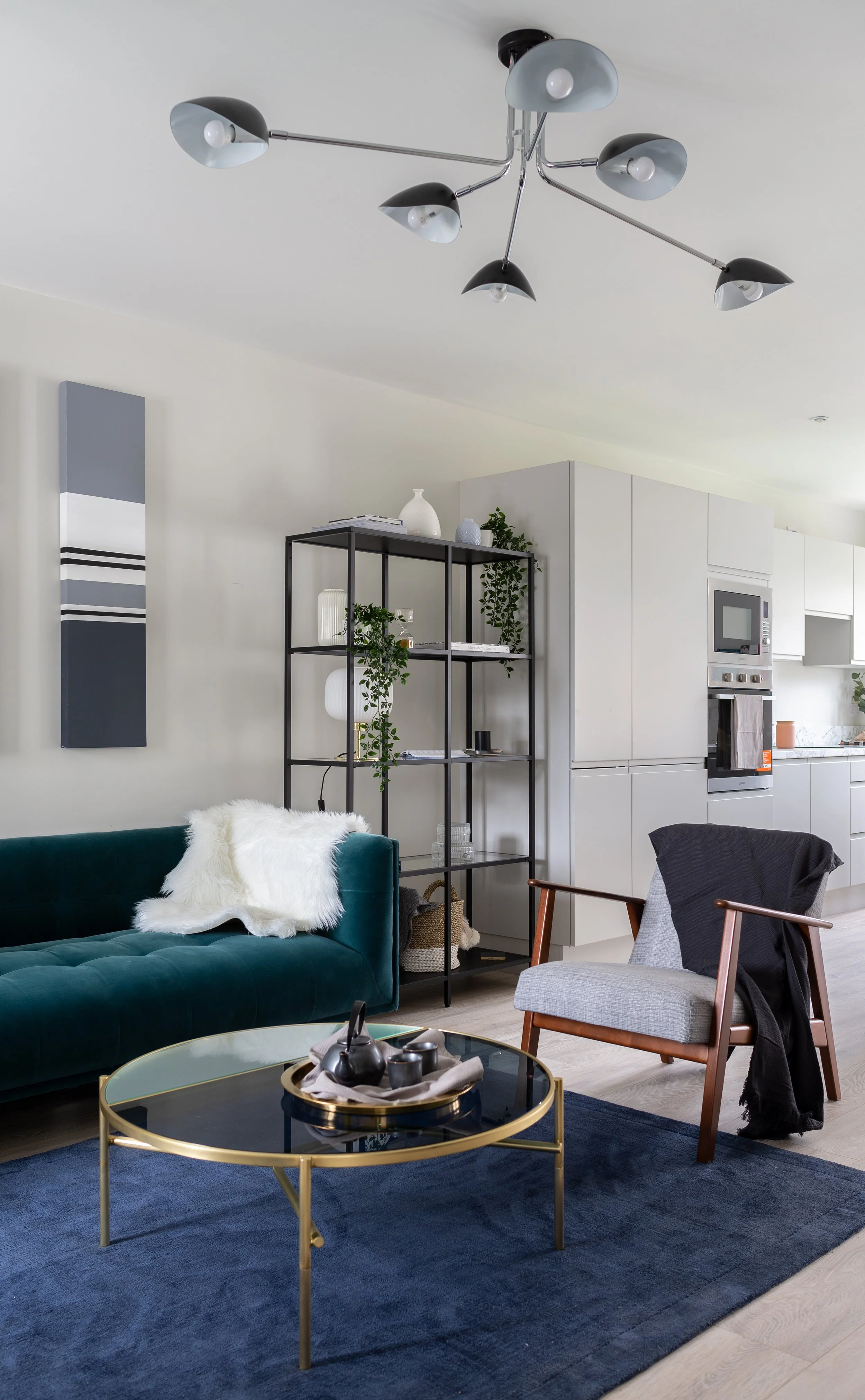 open plan living area with dramatic ceiling light