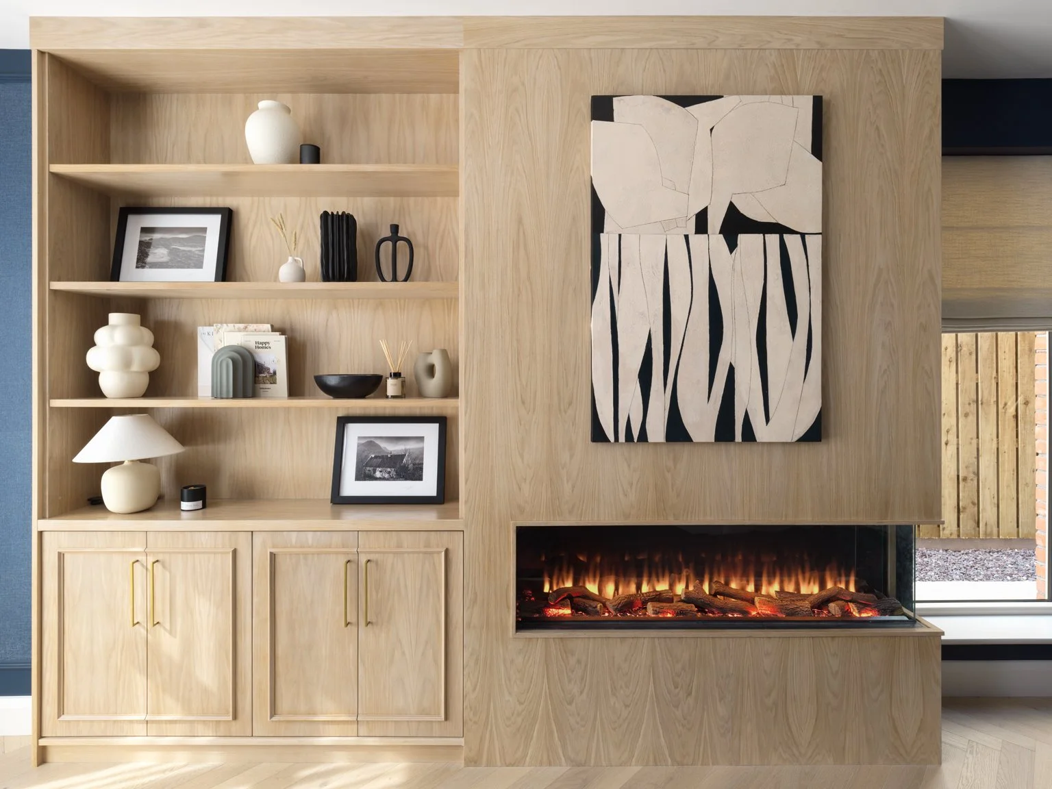 oak cabinetry with integrated electric fire