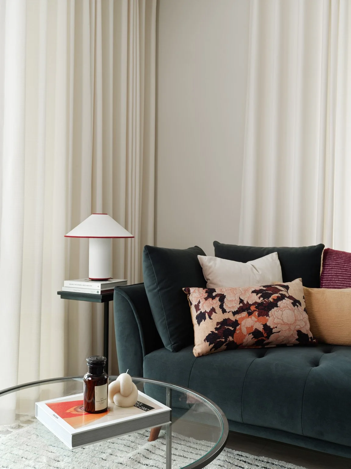 cream drapes with turquoise blue sofa