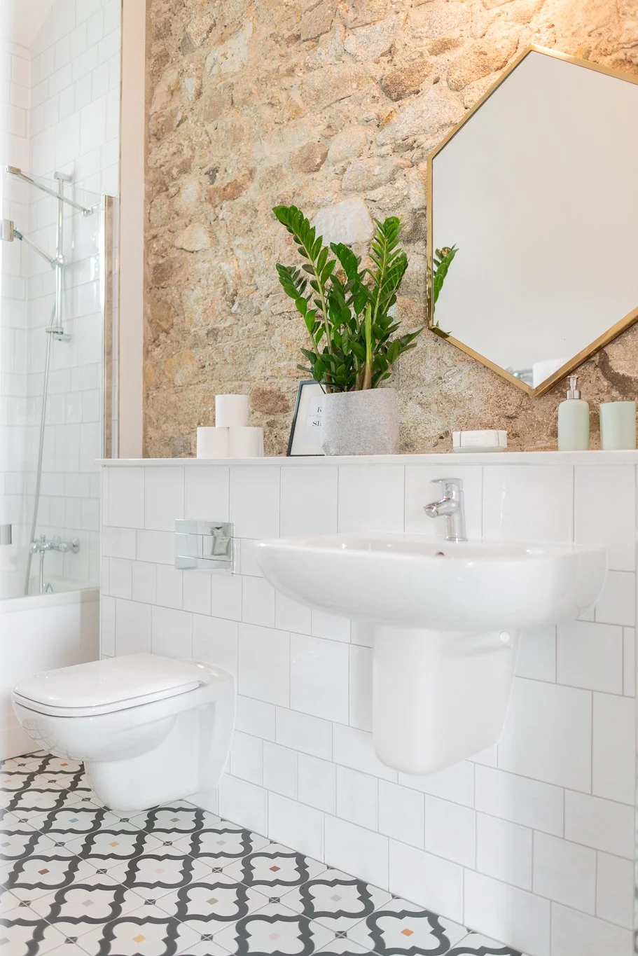 white bathroom with brick wall
