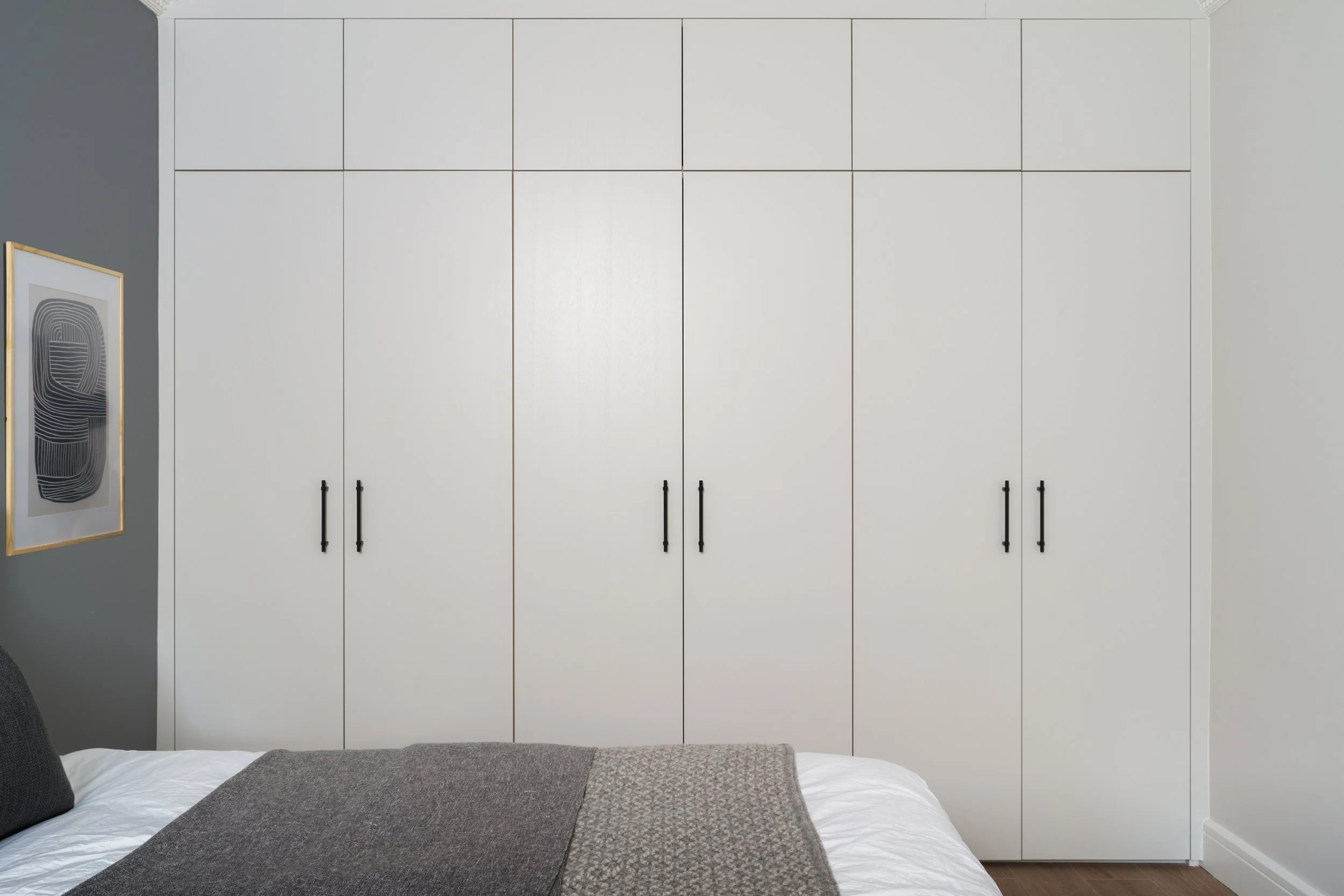 beige in-built bedroom cabinetry