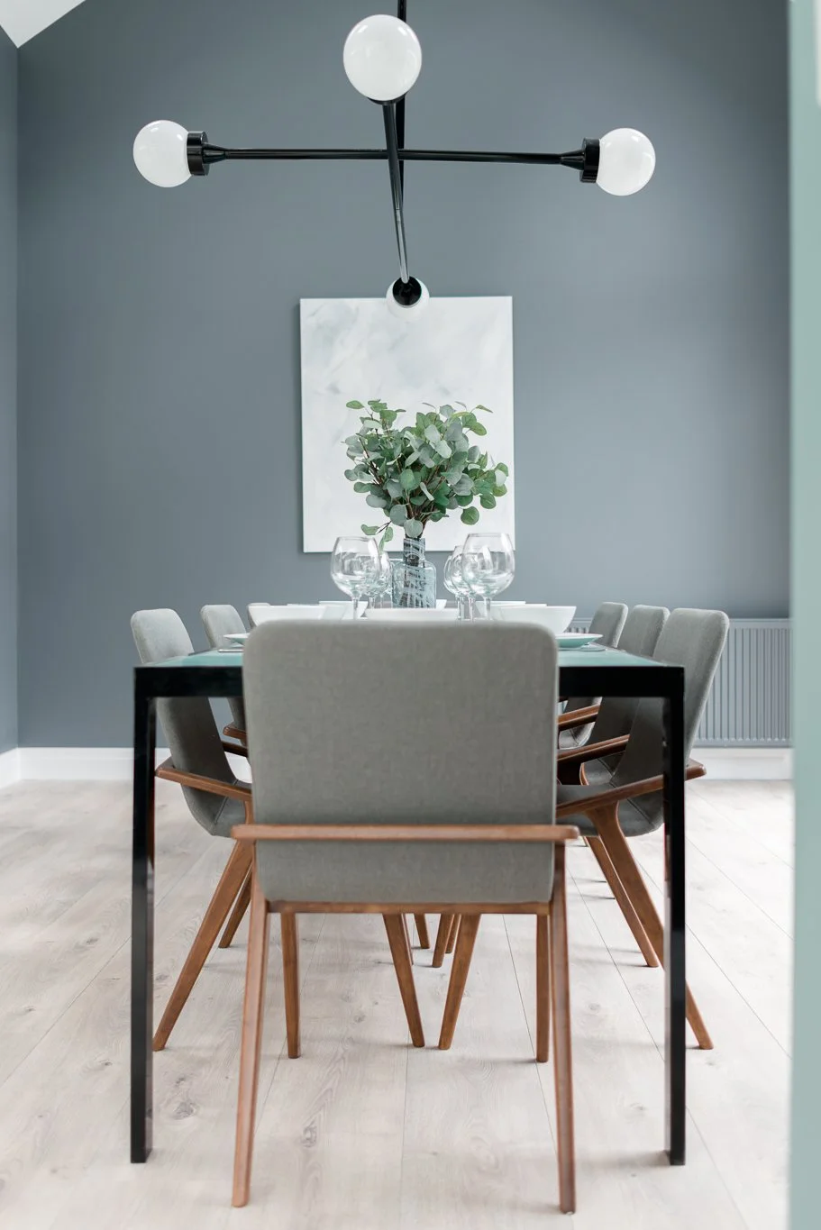 grey and oak dining chairs in dining areas against light blue wall