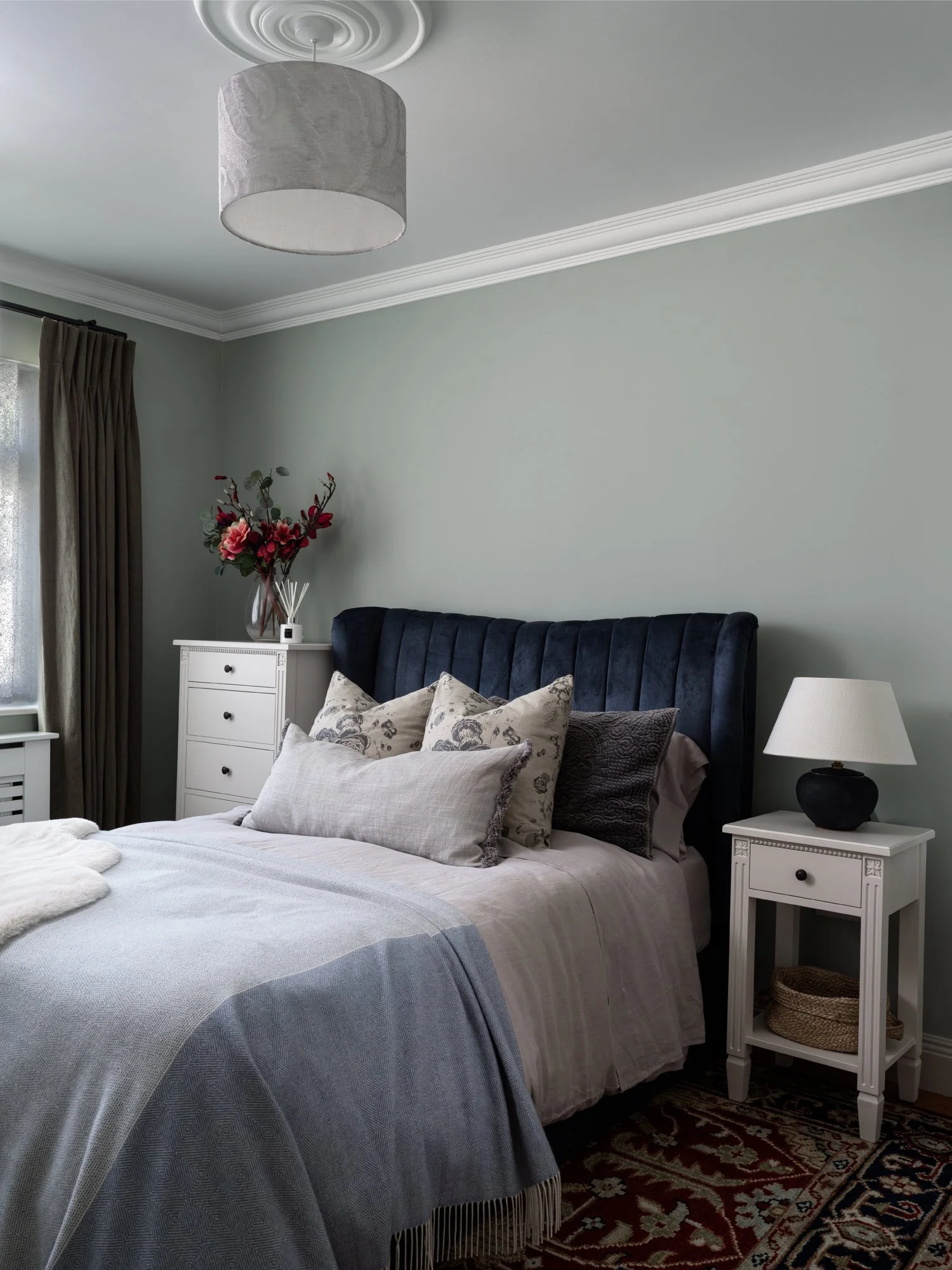 sea foam blue double bedroom with bedside table & lamp