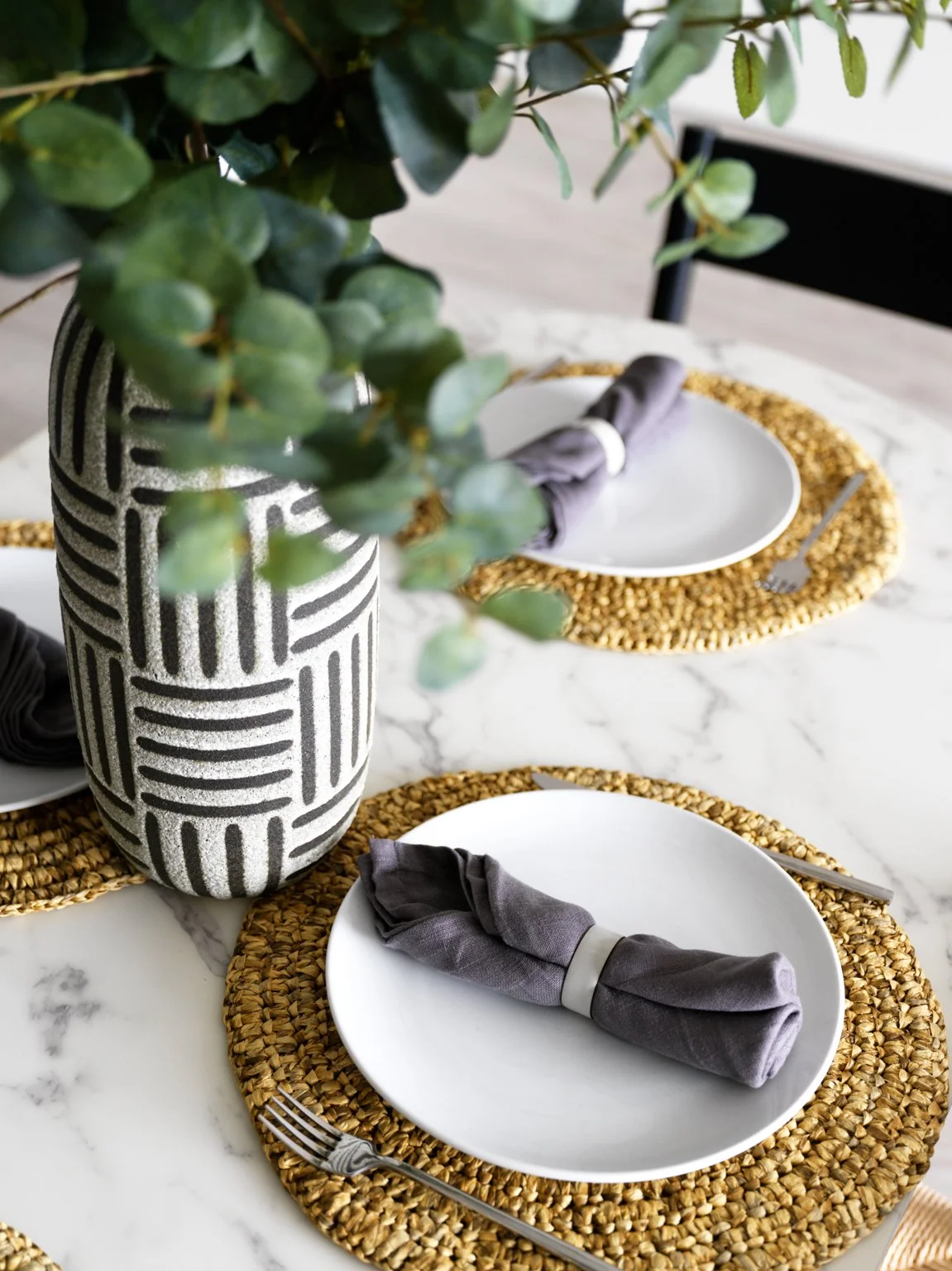 detail shot of rattan placemats and tableware