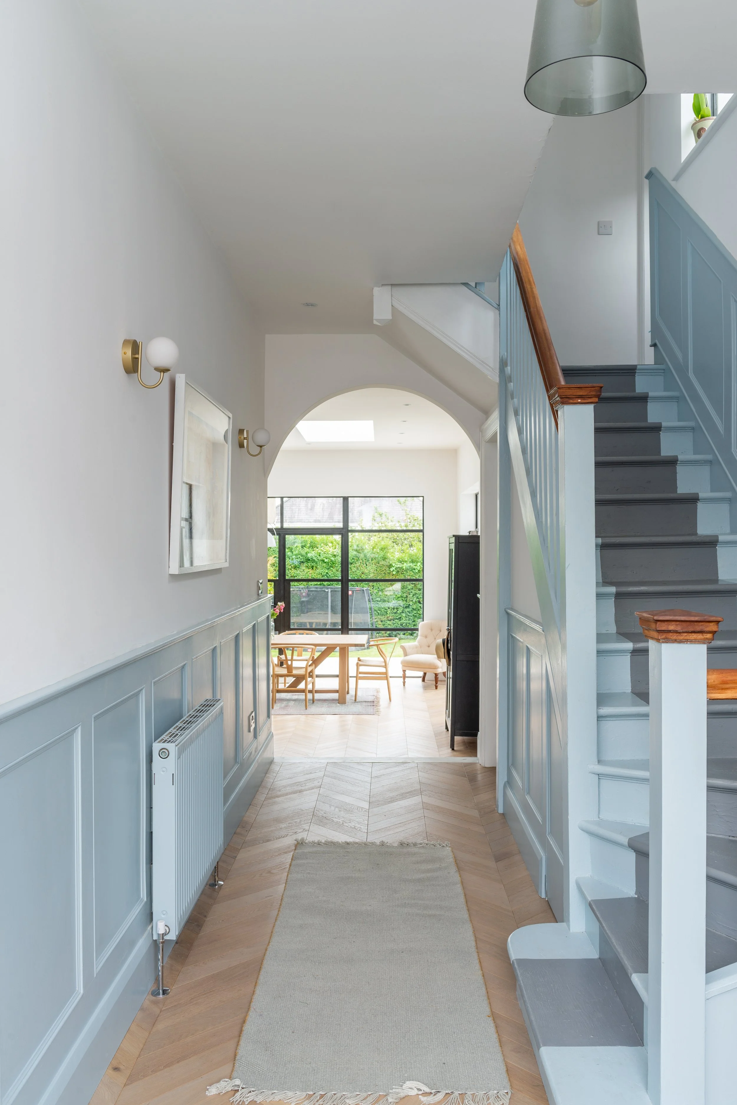 pale blue hallway leading to kitchen