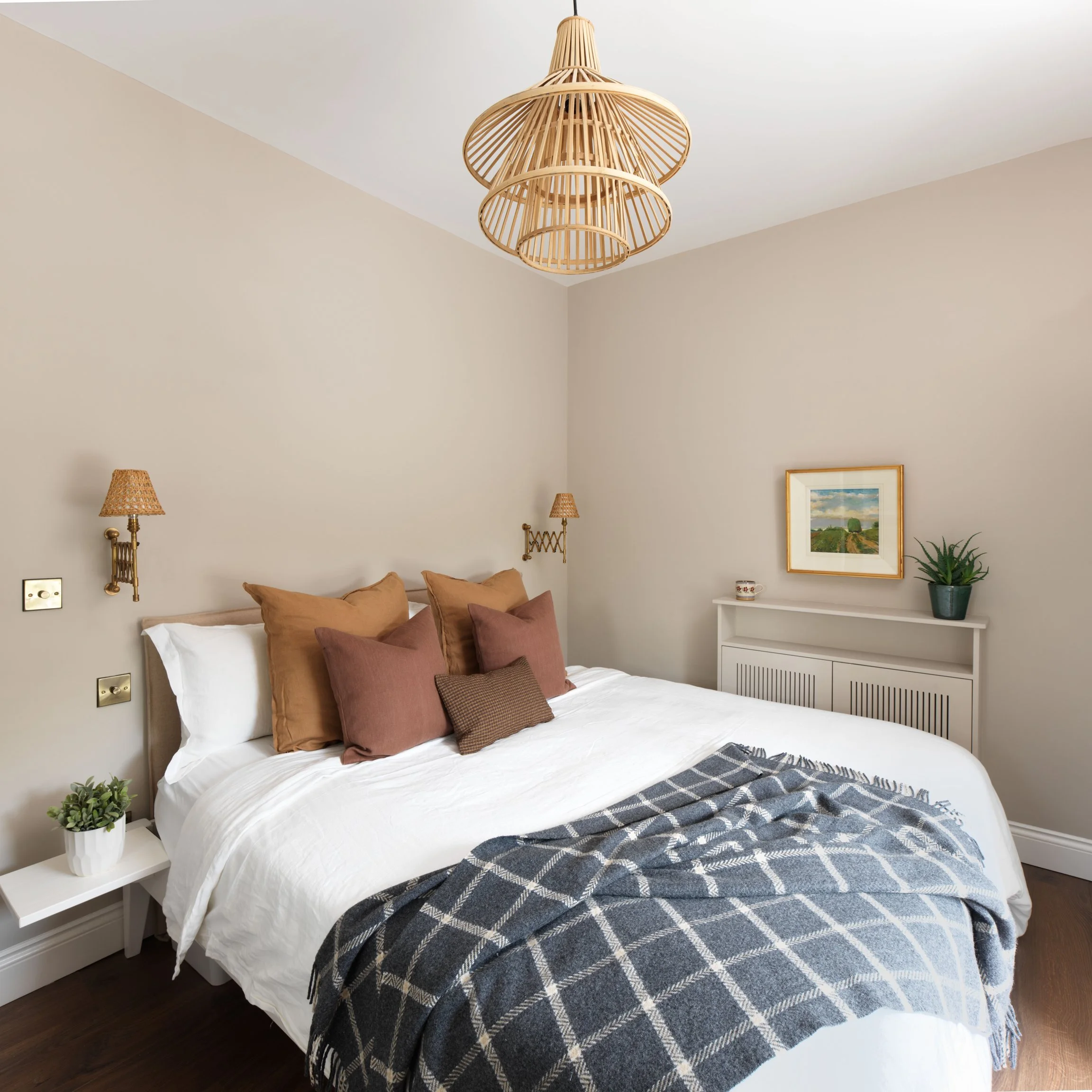 beige master bedroom with rattan lampshade