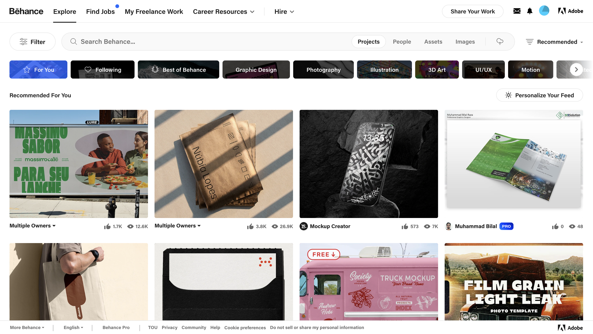 Homepage of Behance displayed on a computer, showing creative projects including packaging, mockups, and advertisements.