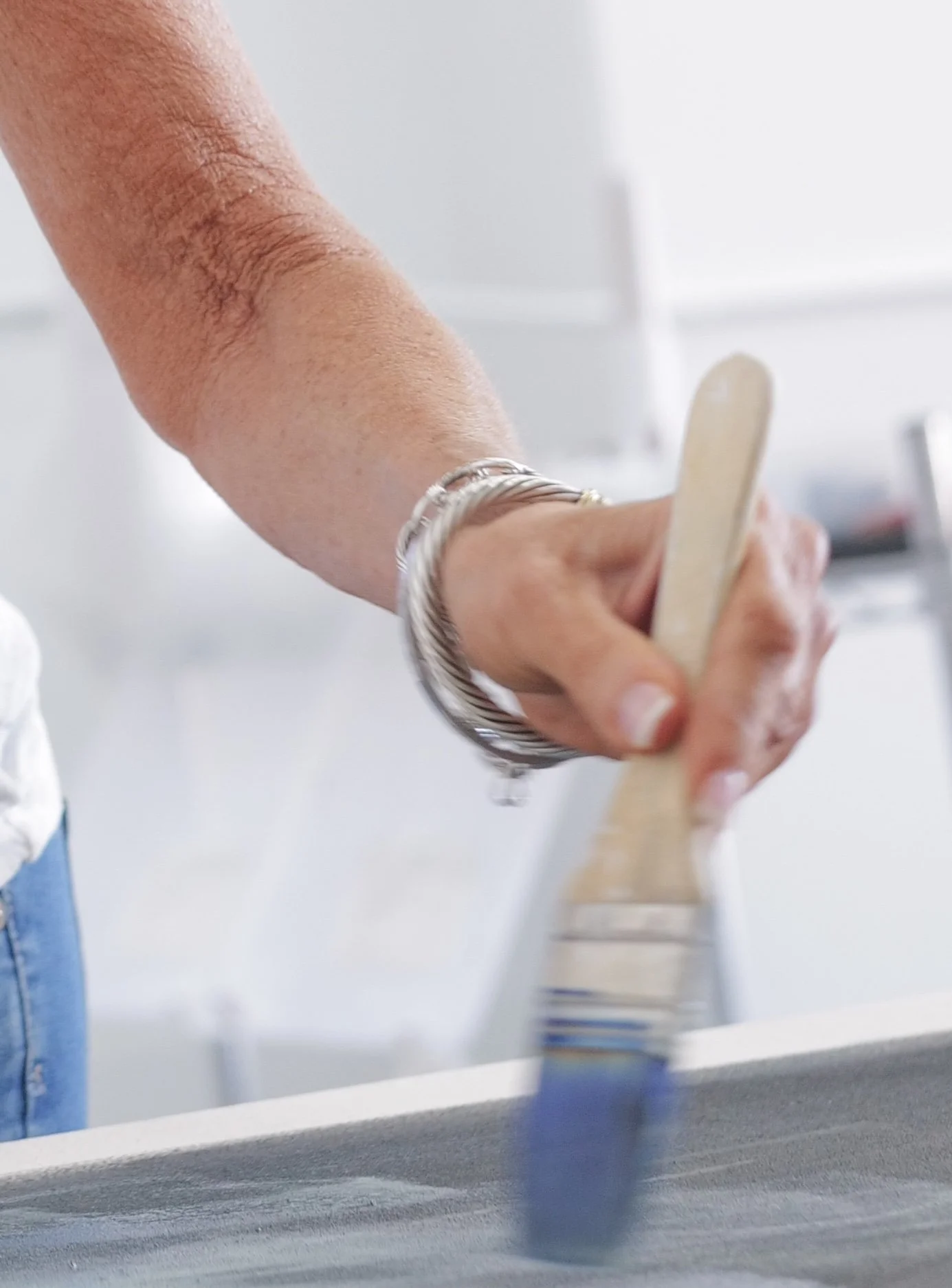 Close up of the painting hand of abstract artist Chris Brandell