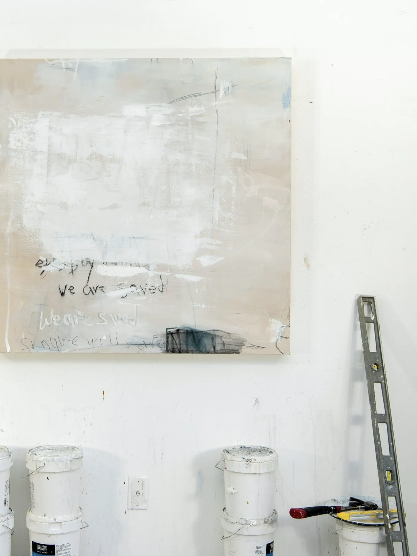 Graffit on Concrete #5 painting by abstract artist, Chris Brandell in the studio with supplies on the floor. This painting includes her iconic written words.