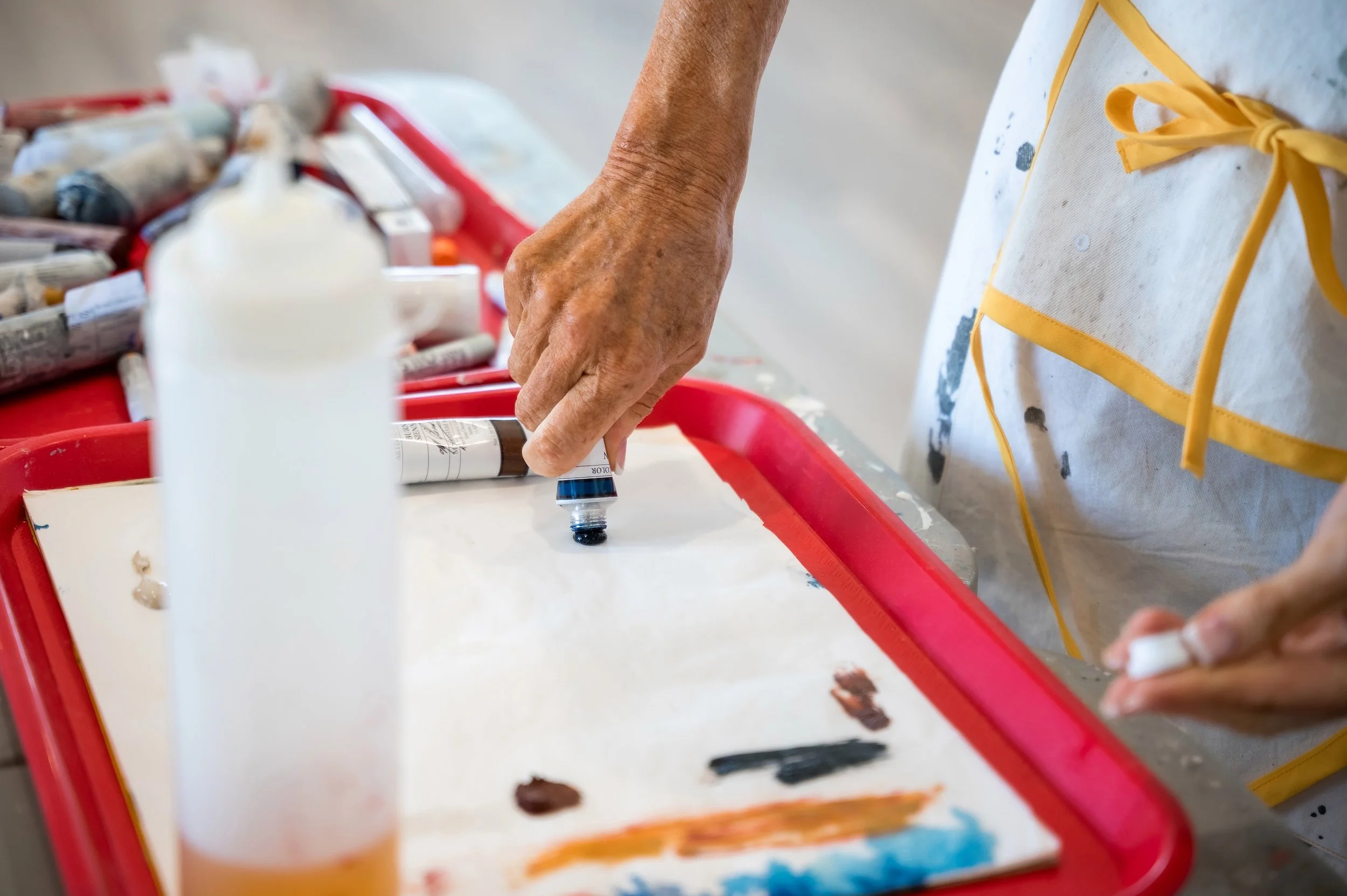 abstract artist Chris Brandell paint palette in studio