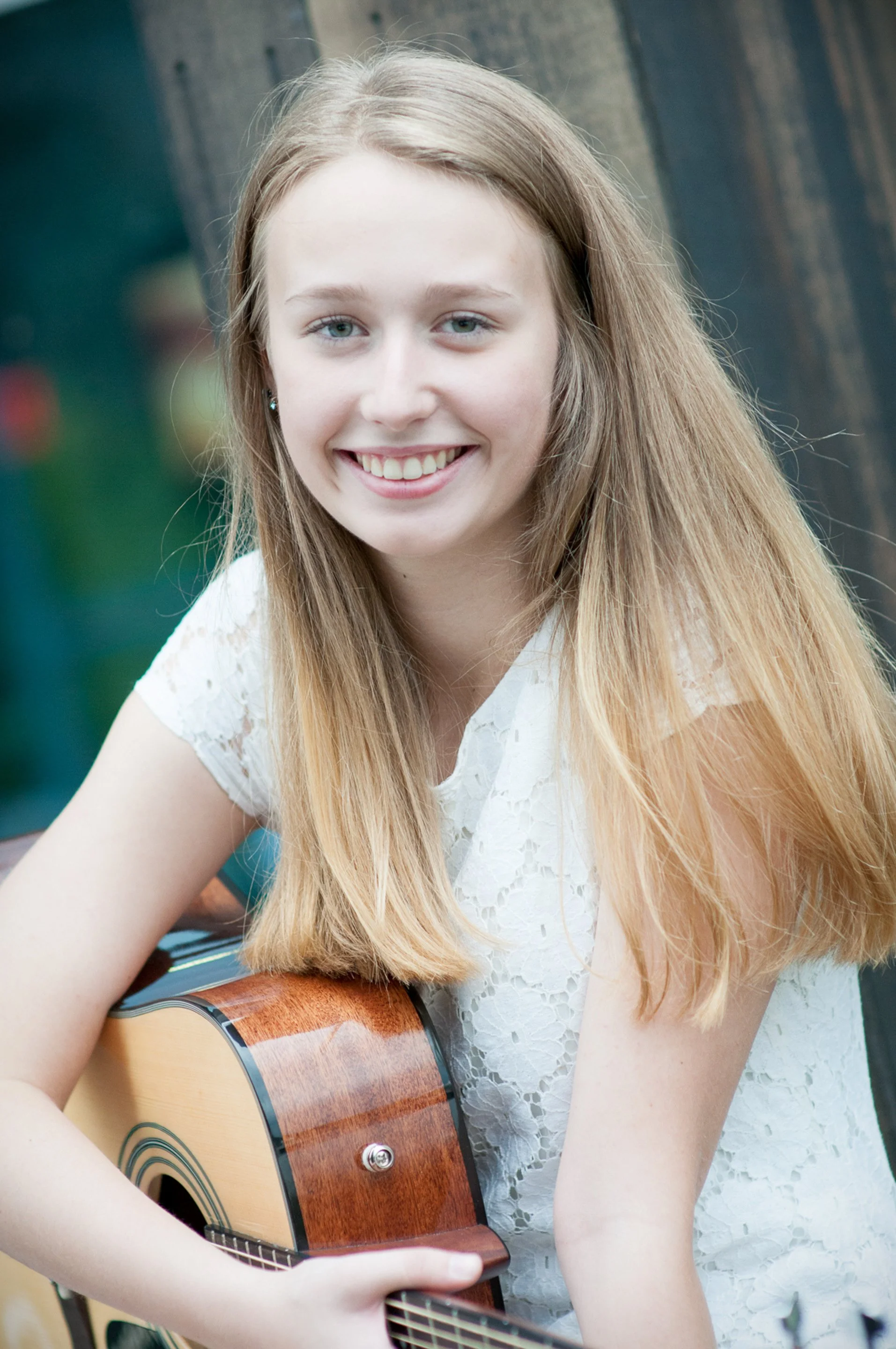 High school senior smiling with an acoustic guitar in a white lace dress, Bethlehem, PA