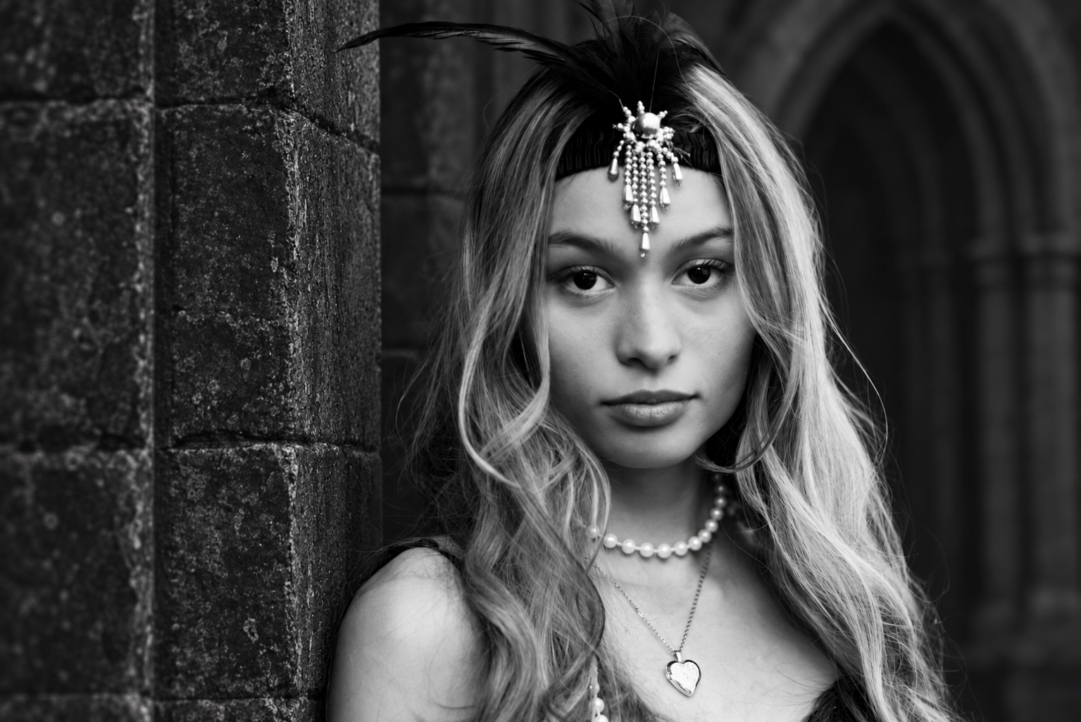 Portrait beneath a Gothic stone arch.png