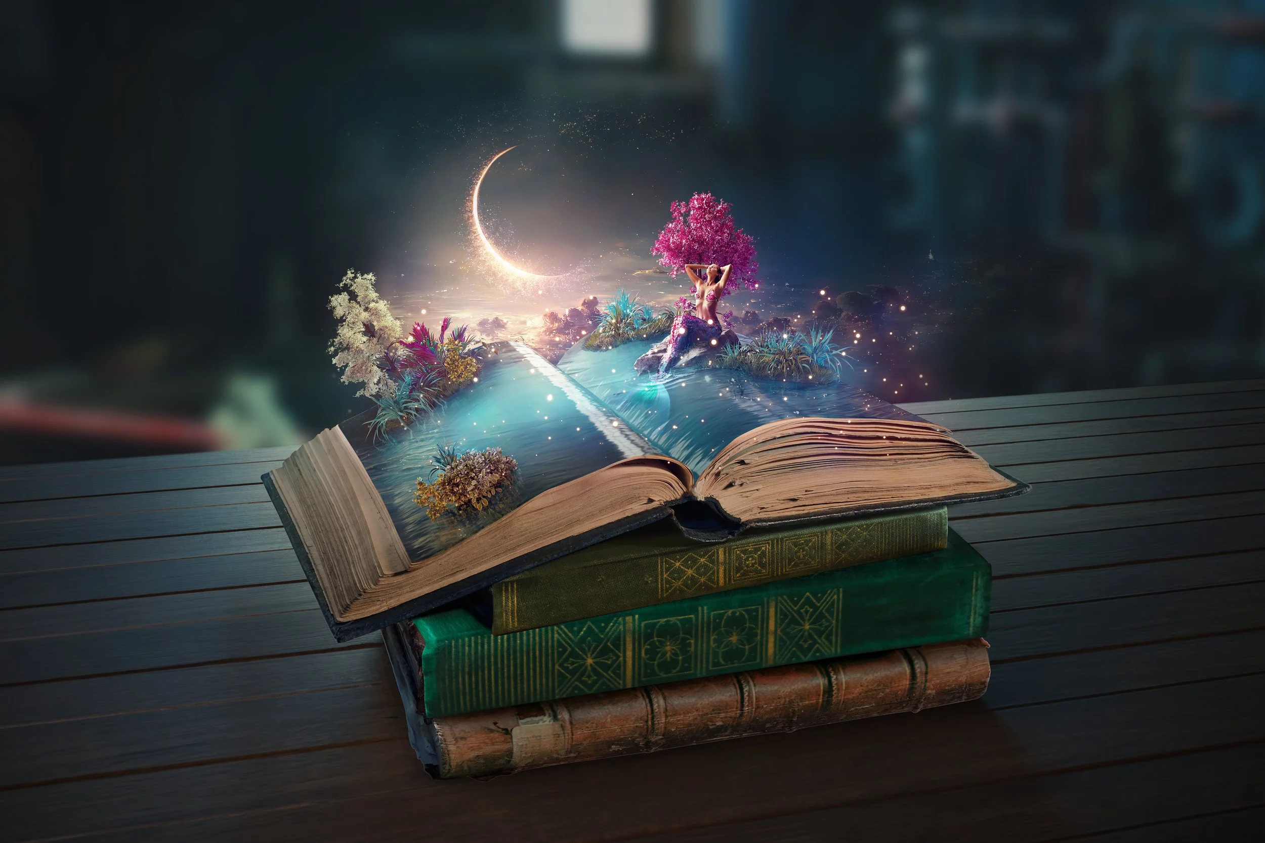 Stack of three old books on a wooden surface with a magical, open book on top. The open book reveals a fantastical scene with colorful plants, a pink tree, a swimmer, a crescent moon, and sparkles, creating a surreal, fairy-tale atmosphere.