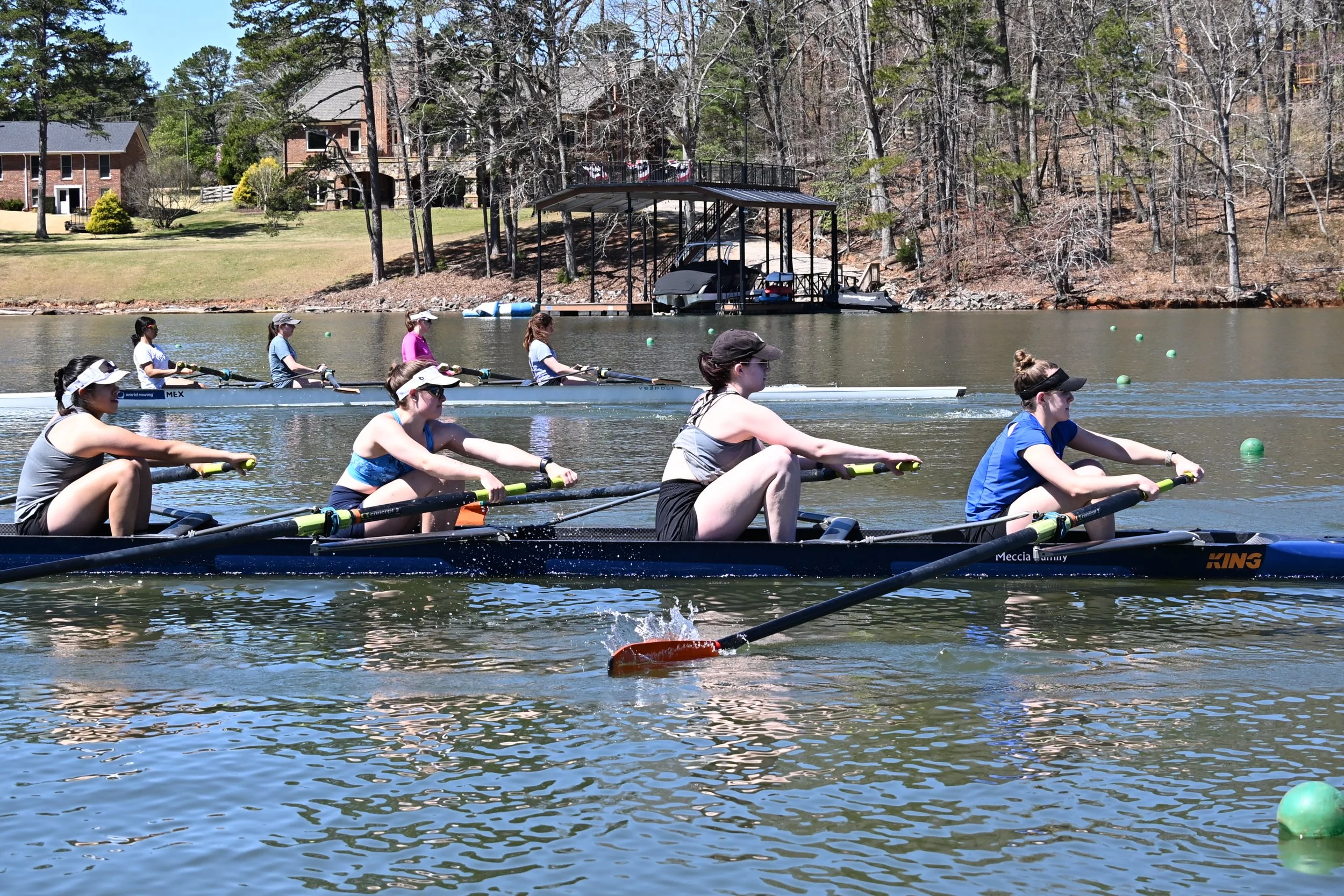   Mixed novice-varsity women fours racing at a low rate.  