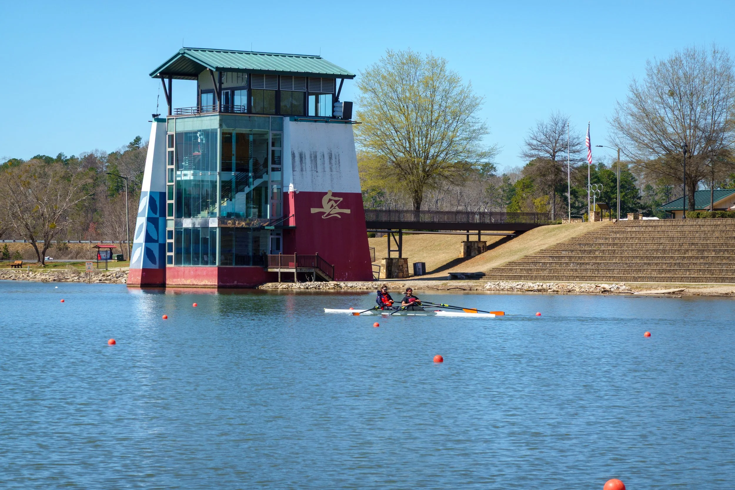   A varsity women double rowing down the Atlanta 1996 olympic course.  