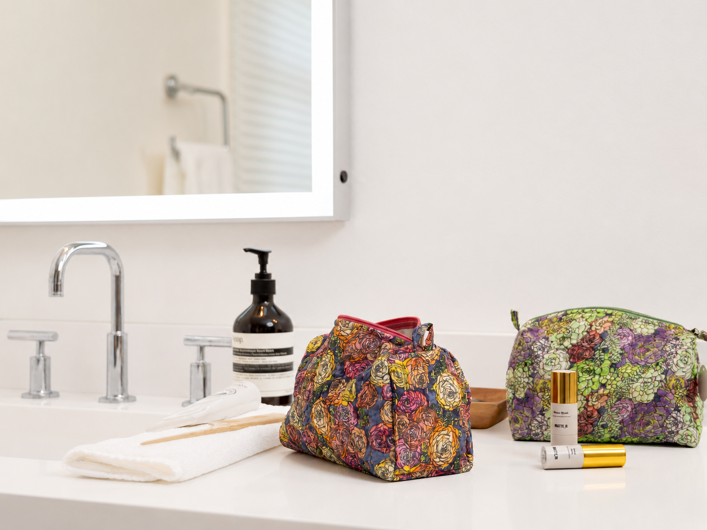 Abigail Leigh Designs Ranunculus Pouch and Succulent Pouch in Bathroom.png