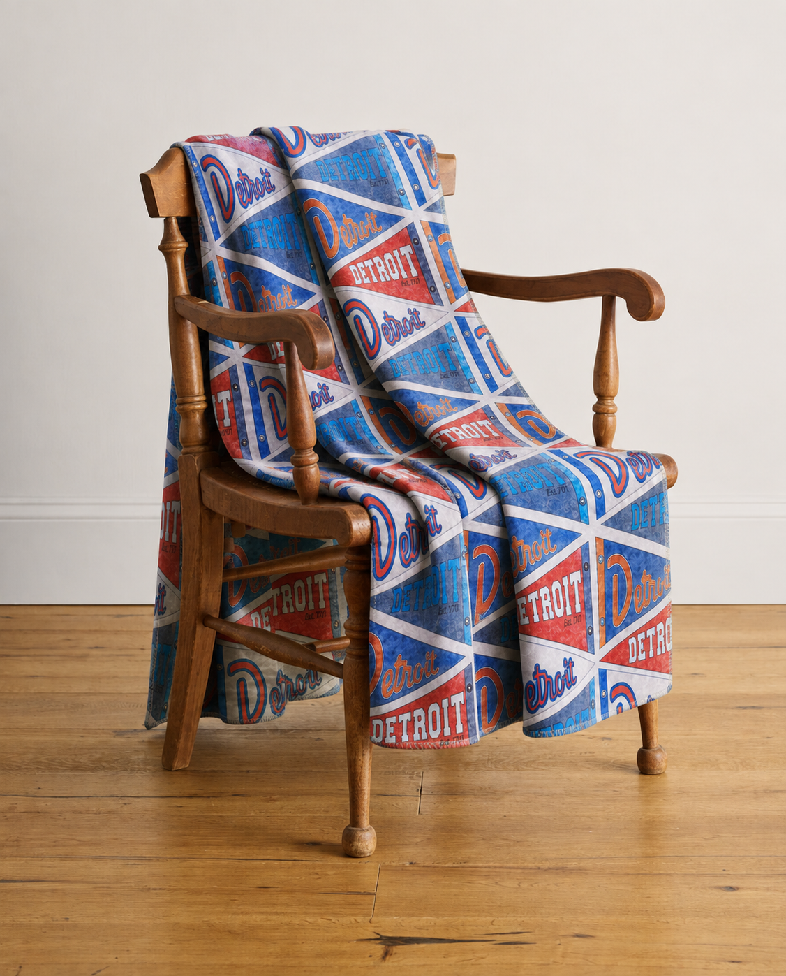 Abigail Leigh Designs Detroit Pendents Blanket on chair.png