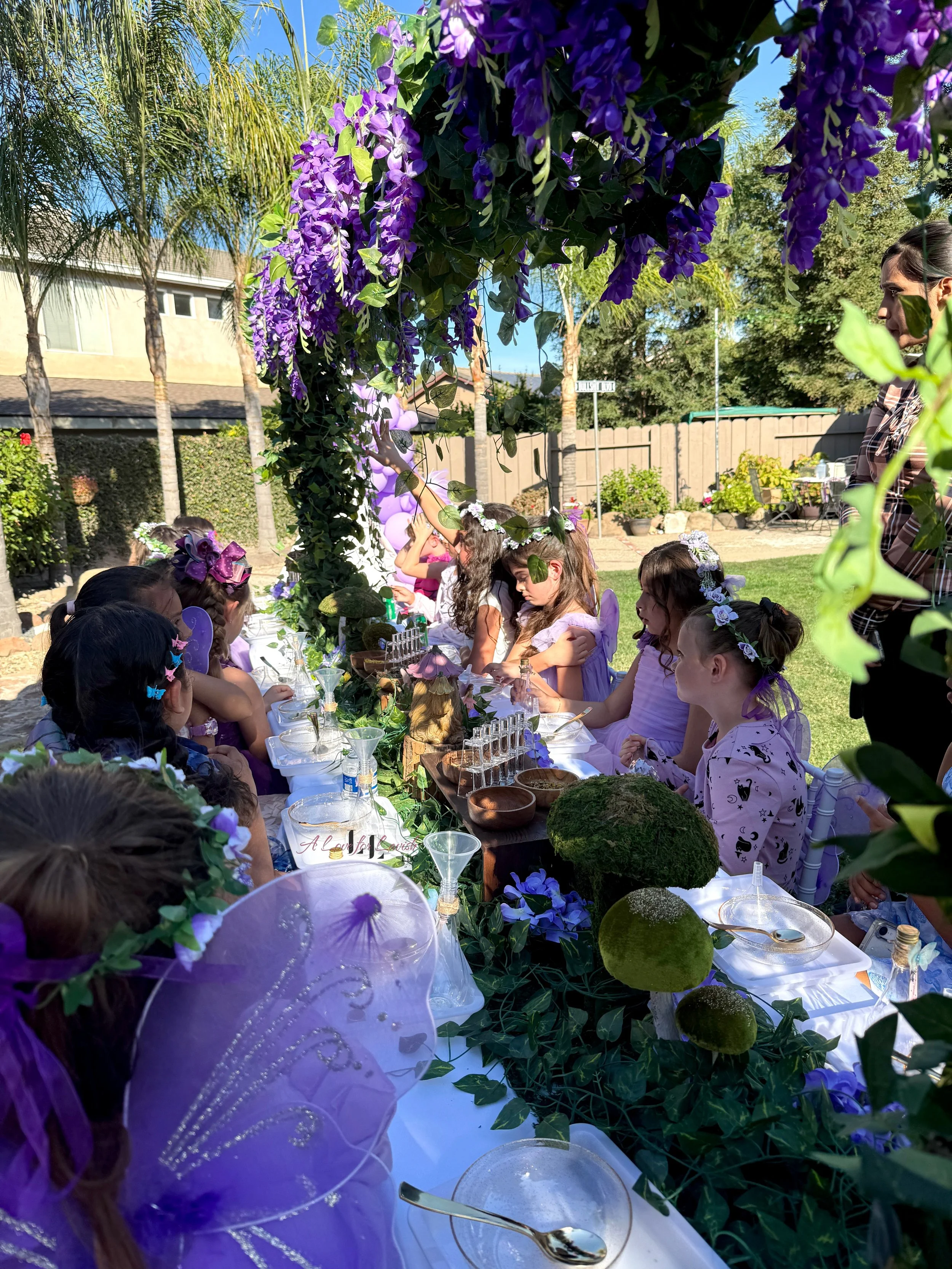 Fairy themed birthday party wands potions wand potion diy activity station kids party ideas activity tables table central valley bay area event planner stem science imagination creativity balloons balloon garland
