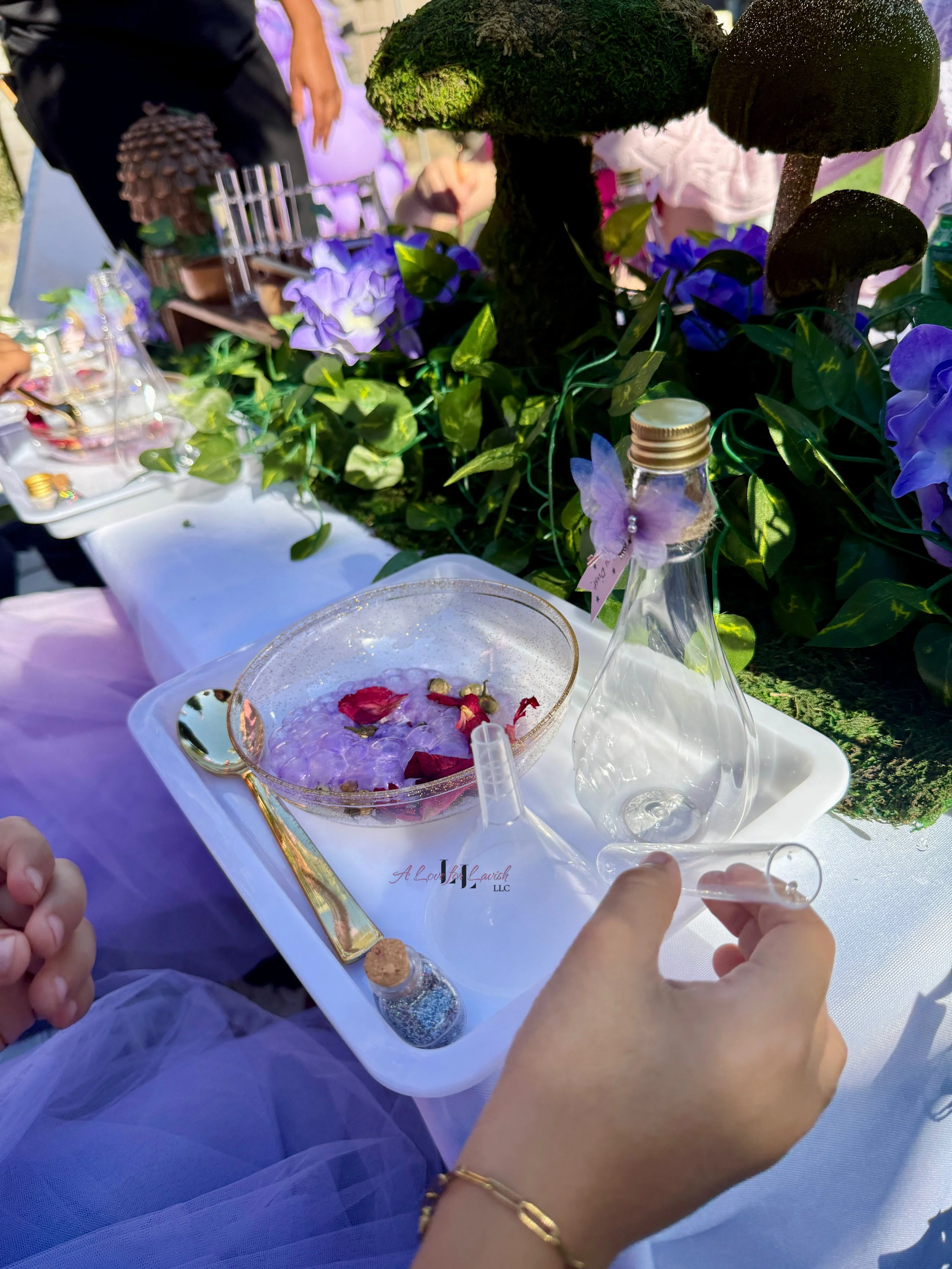 Fairy themed birthday party wands potions wand potion diy activity station kids party ideas activity tables table central valley bay area event planner stem science imagination creativity balloons balloon garland