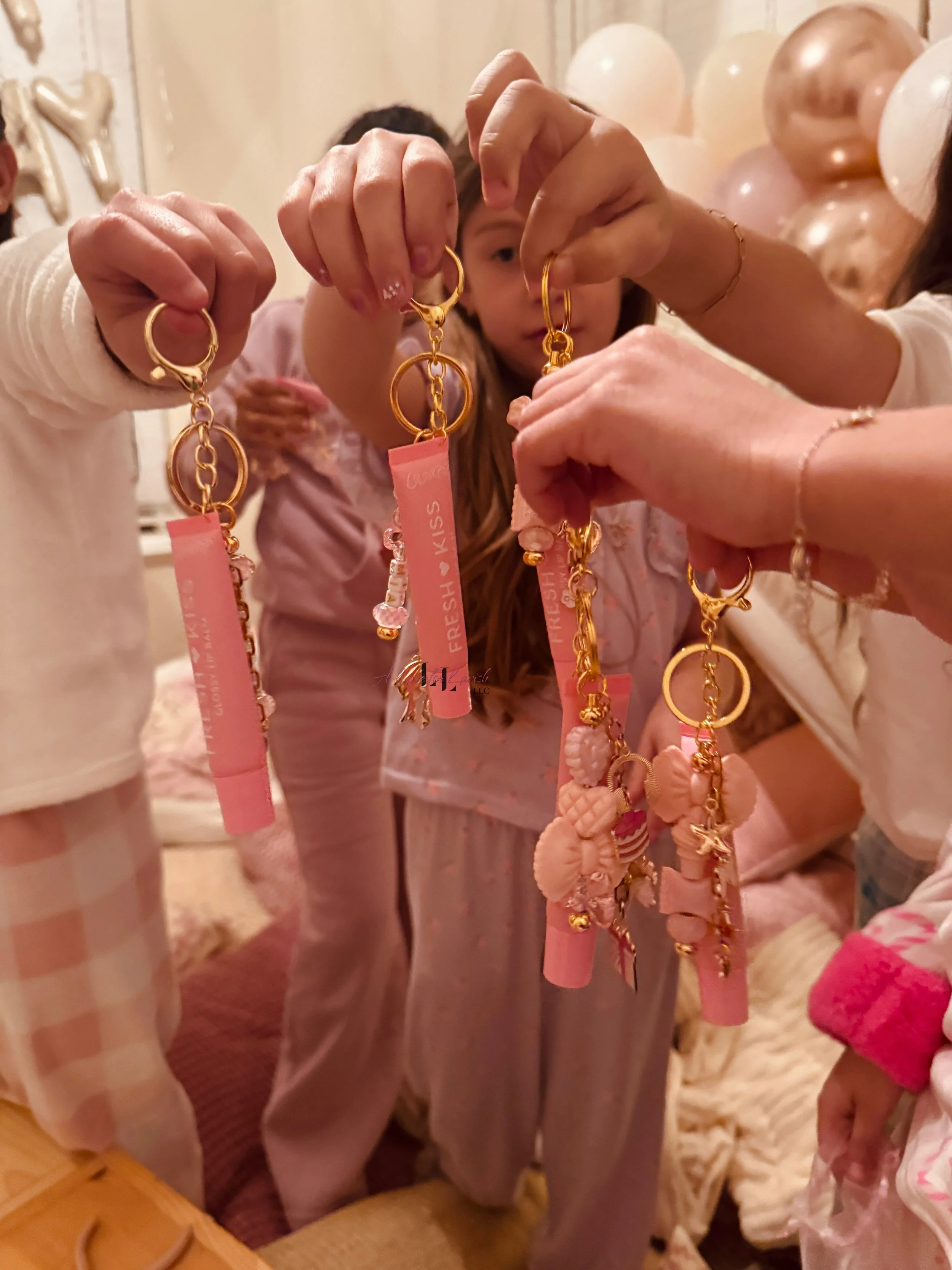 Kids craft activity table ideas birthday party girl girlhood charms lip gloss keychain keychains colourpop best friends preteen teen teens custom paper clip chain beads bay area central valley 