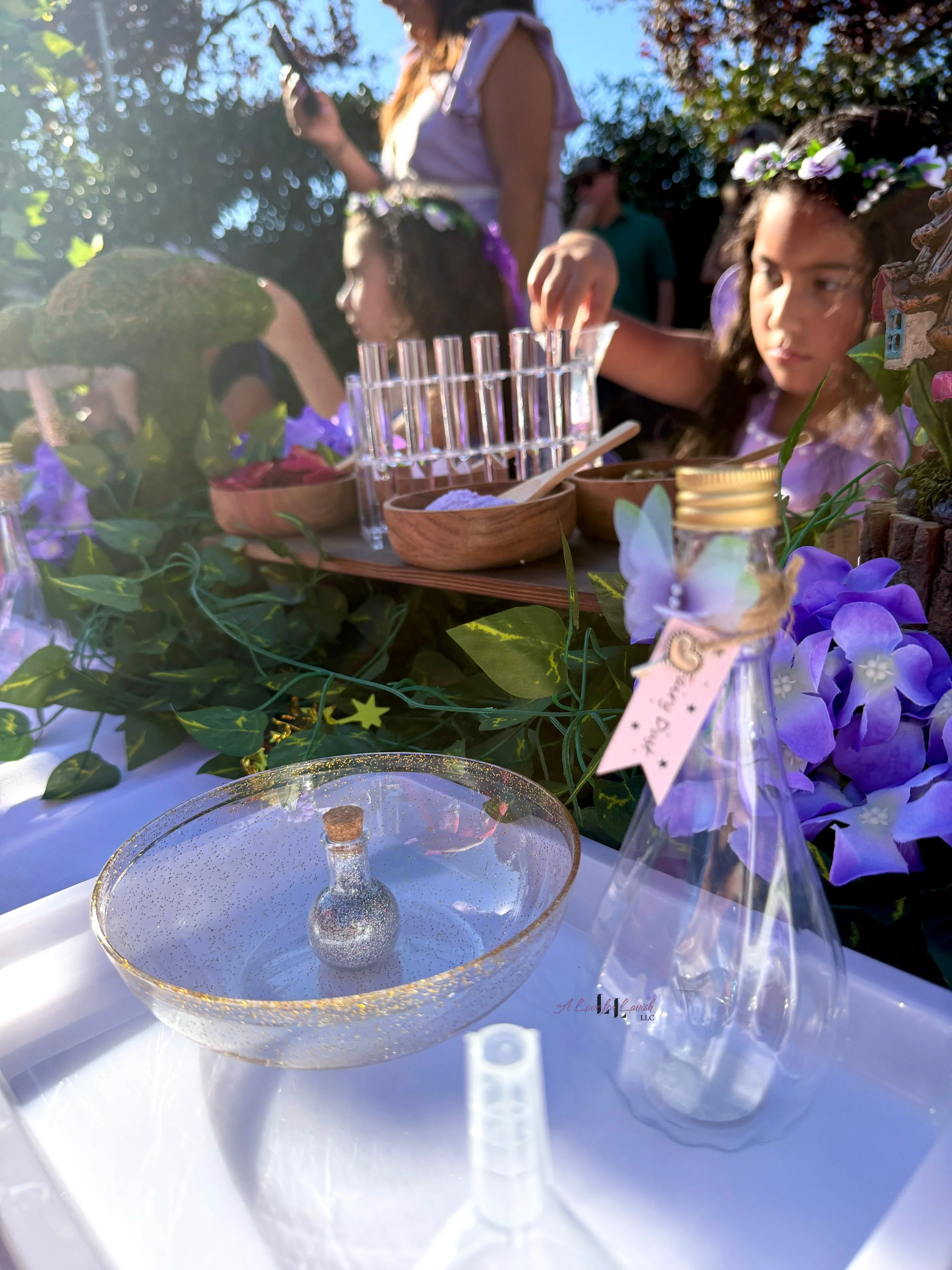 Fairy themed birthday party wands potions wand potion diy activity station kids party ideas activity tables table central valley bay area event planner stem science imagination creativity balloons balloon garland