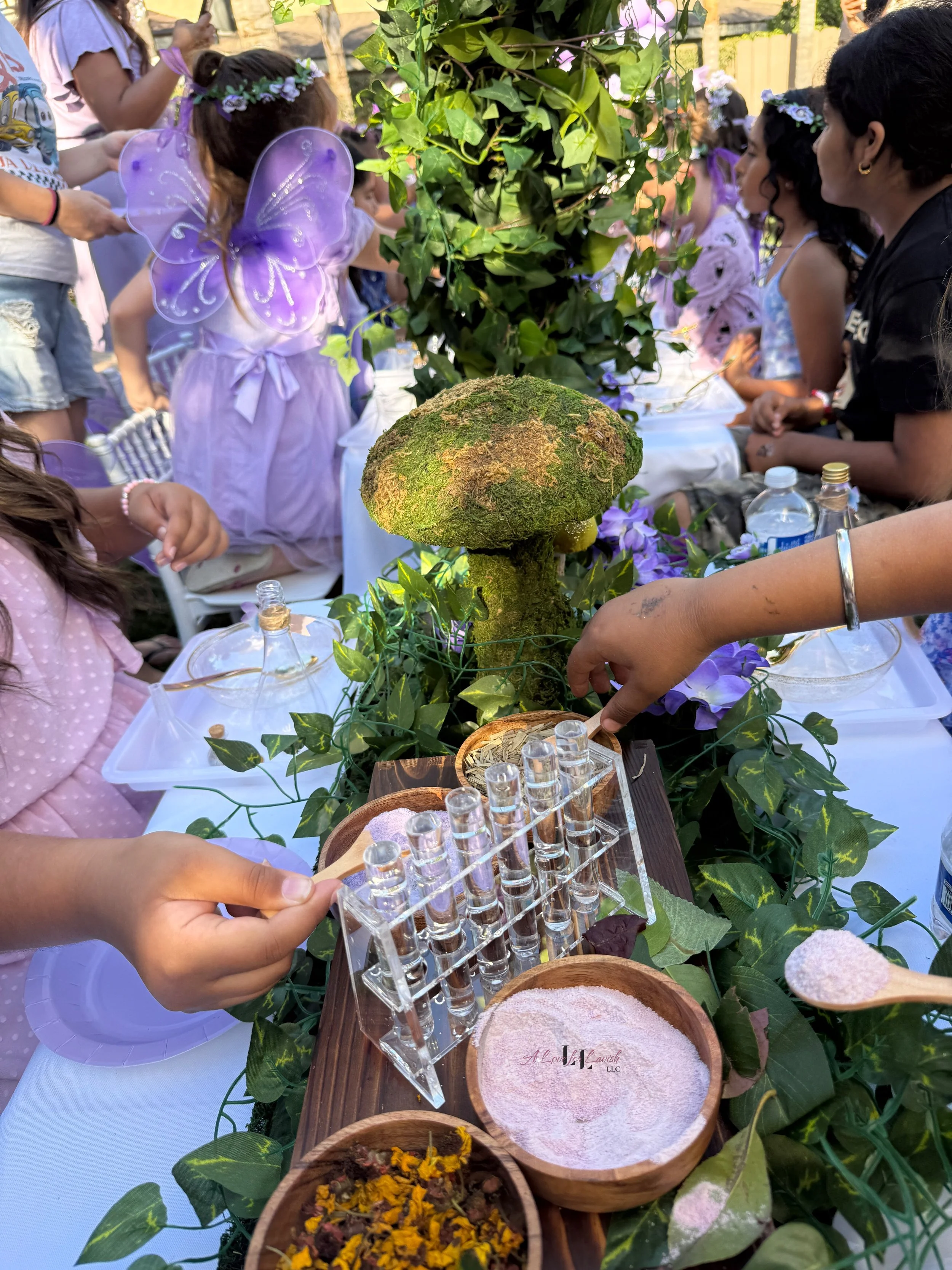 Fairy themed birthday party wands potions wand potion diy activity station kids party ideas activity tables table central valley bay area event planner stem science imagination creativity balloons balloon garland