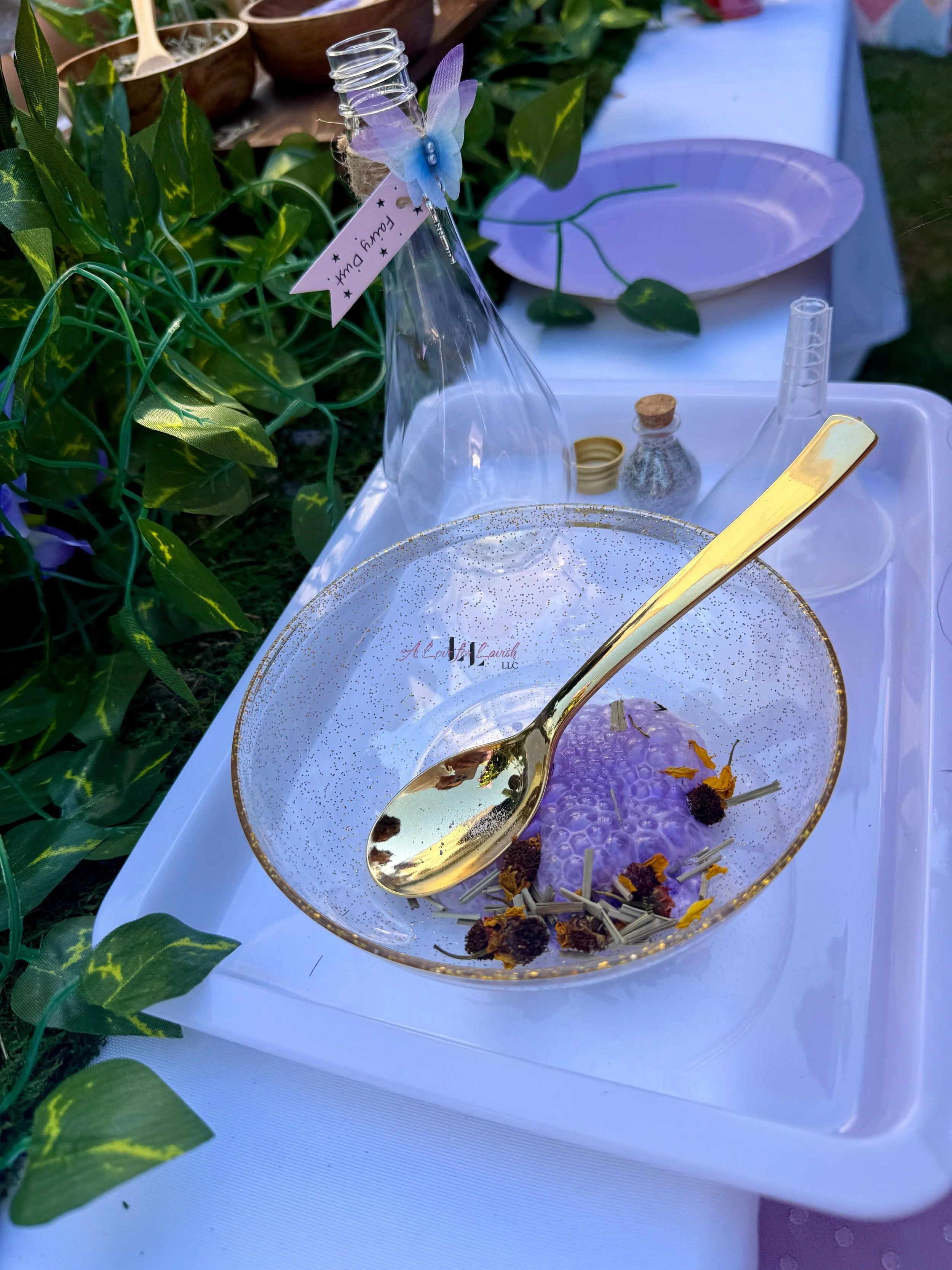 Fairy themed birthday party wands potions wand potion diy activity station kids party ideas activity tables table central valley bay area event planner stem science imagination creativity balloons balloon garland