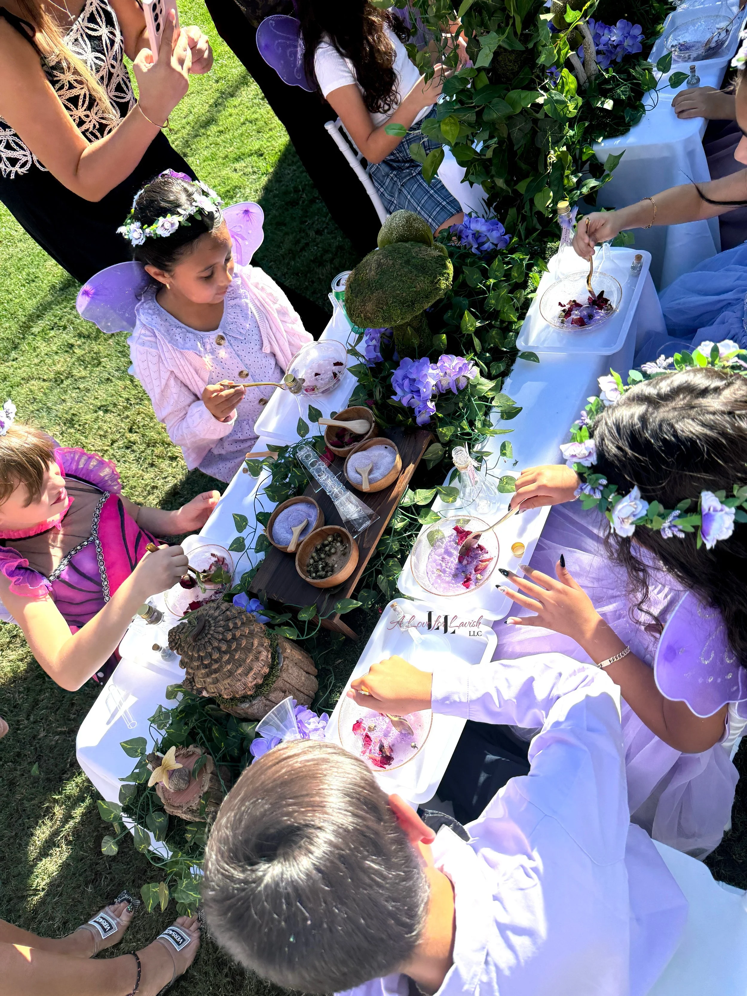 Fairy themed birthday party wands potions wand potion diy activity station kids party ideas activity tables table central valley bay area event planner stem science imagination creativity balloons balloon garland