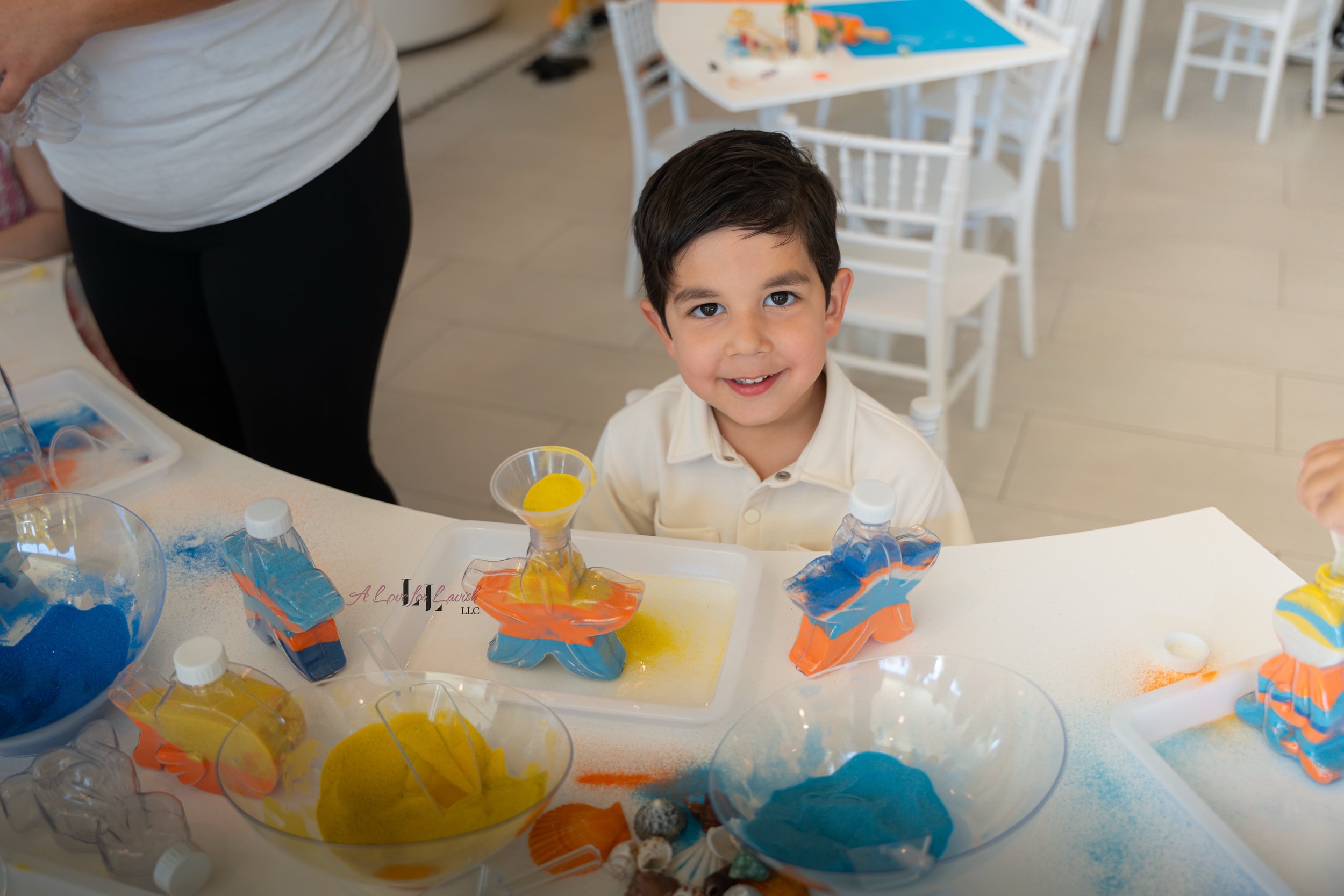 kids sand art station activity table sensory birthday party one in the sun summer theme beach colorful clay playdoh fun crafts art first birthday ideas 1st creative play activities hands on