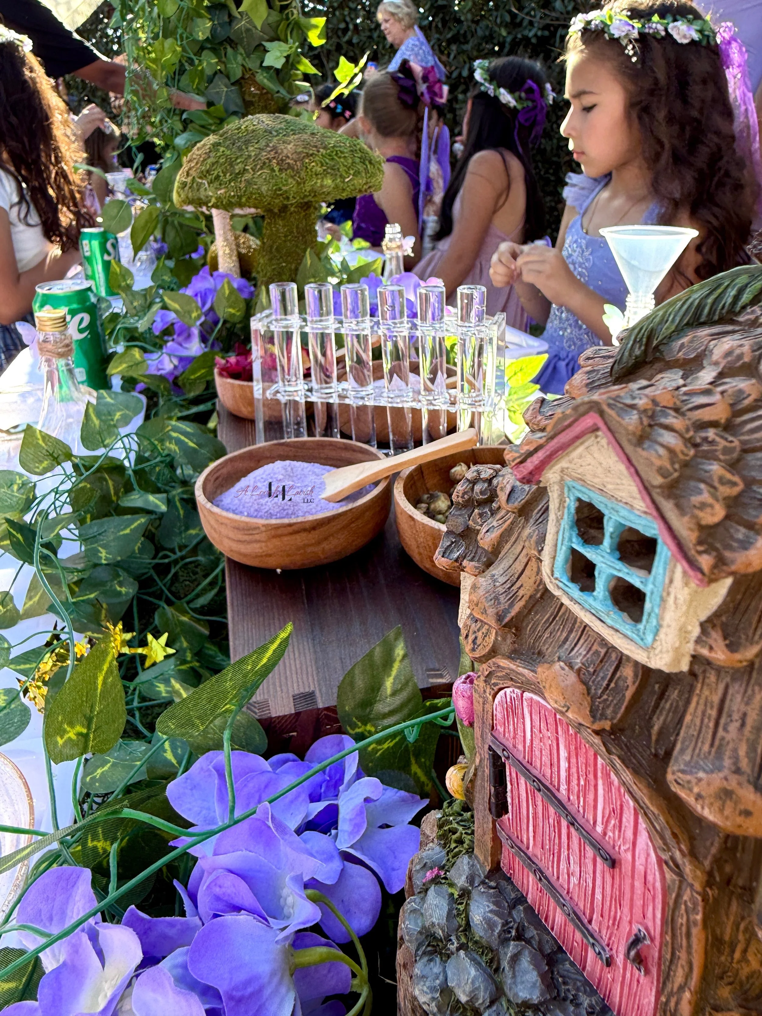 Fairy themed birthday party wands potions wand potion diy activity station kids party ideas activity tables table central valley bay area event planner stem science imagination creativity balloons balloon garland