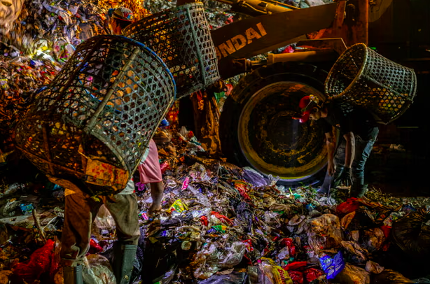 ‘The trash does not stop’: life among the garbage mountains of the world’s biggest city