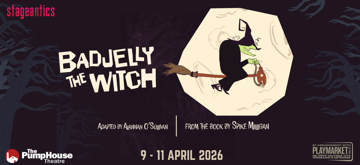 A banner poster, featuring a green-skinned, black-clad witch riding a broomstick.