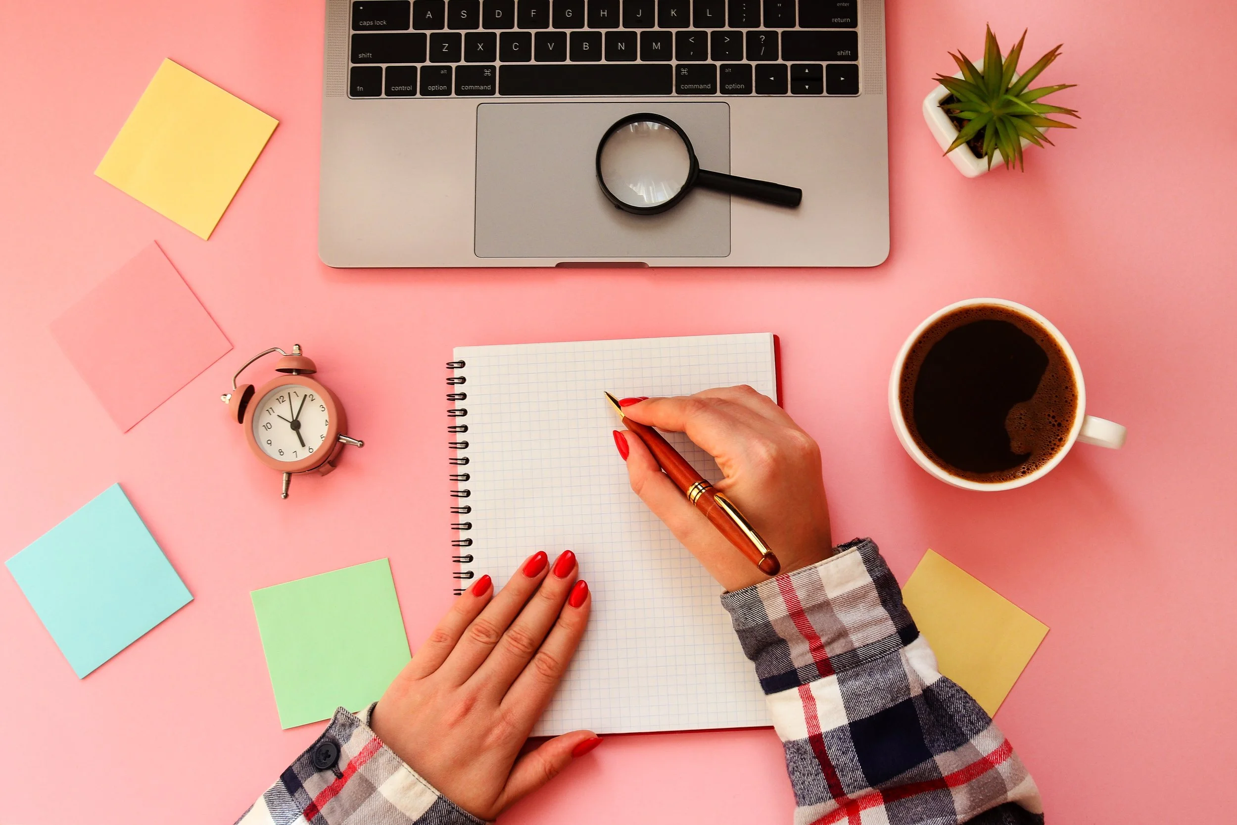 Woman hands writing in laptop. Feminine workplace with laptop, n
