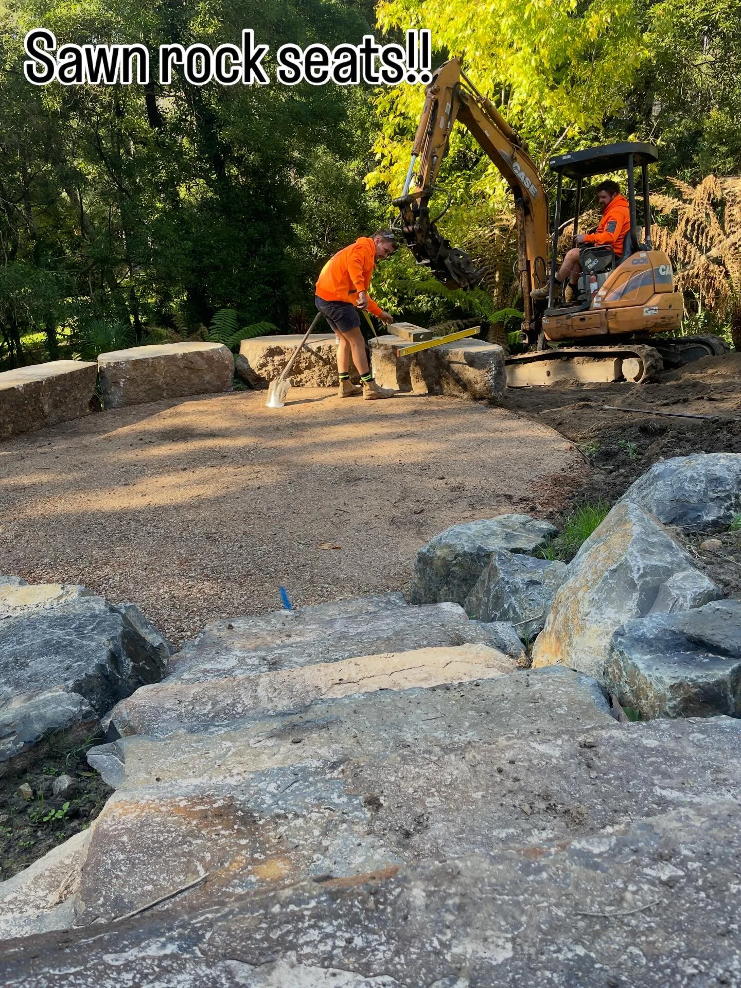 Fantastic effort by the @yarra_ridge_landscapes team getting these oversized sawn rock seats in place today to complete the firepit area. There&rsquo;s a steep fall off to the rear so a precarious operation.
.
.
#sawnrocks #rockwall #landscapedesign 