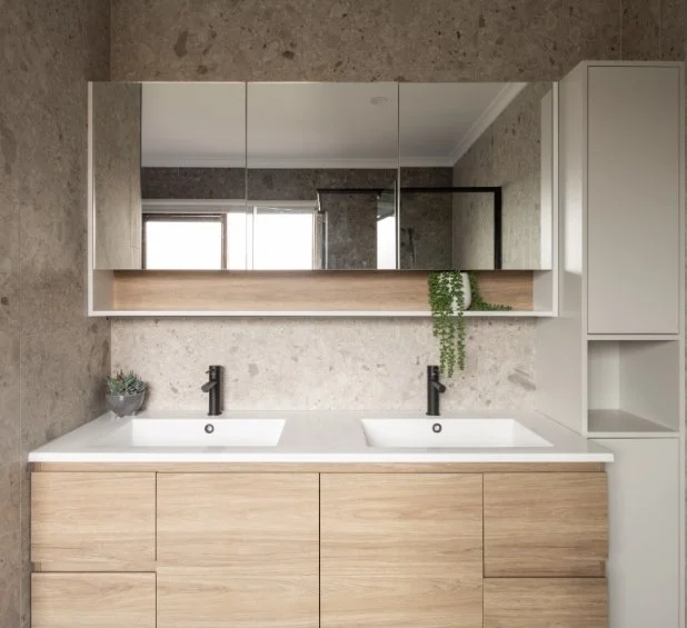 timber bathroom with white sinks and black taps