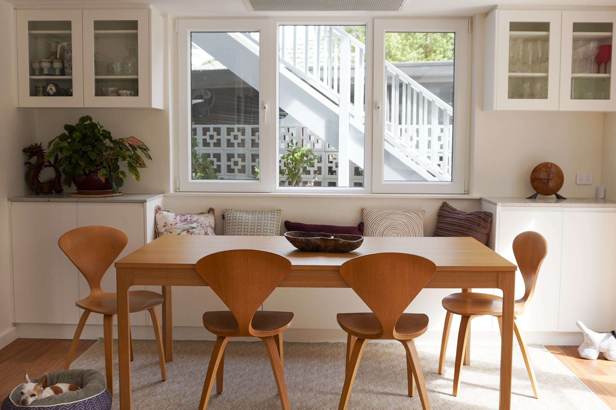 Timber dining table with double glazed windows