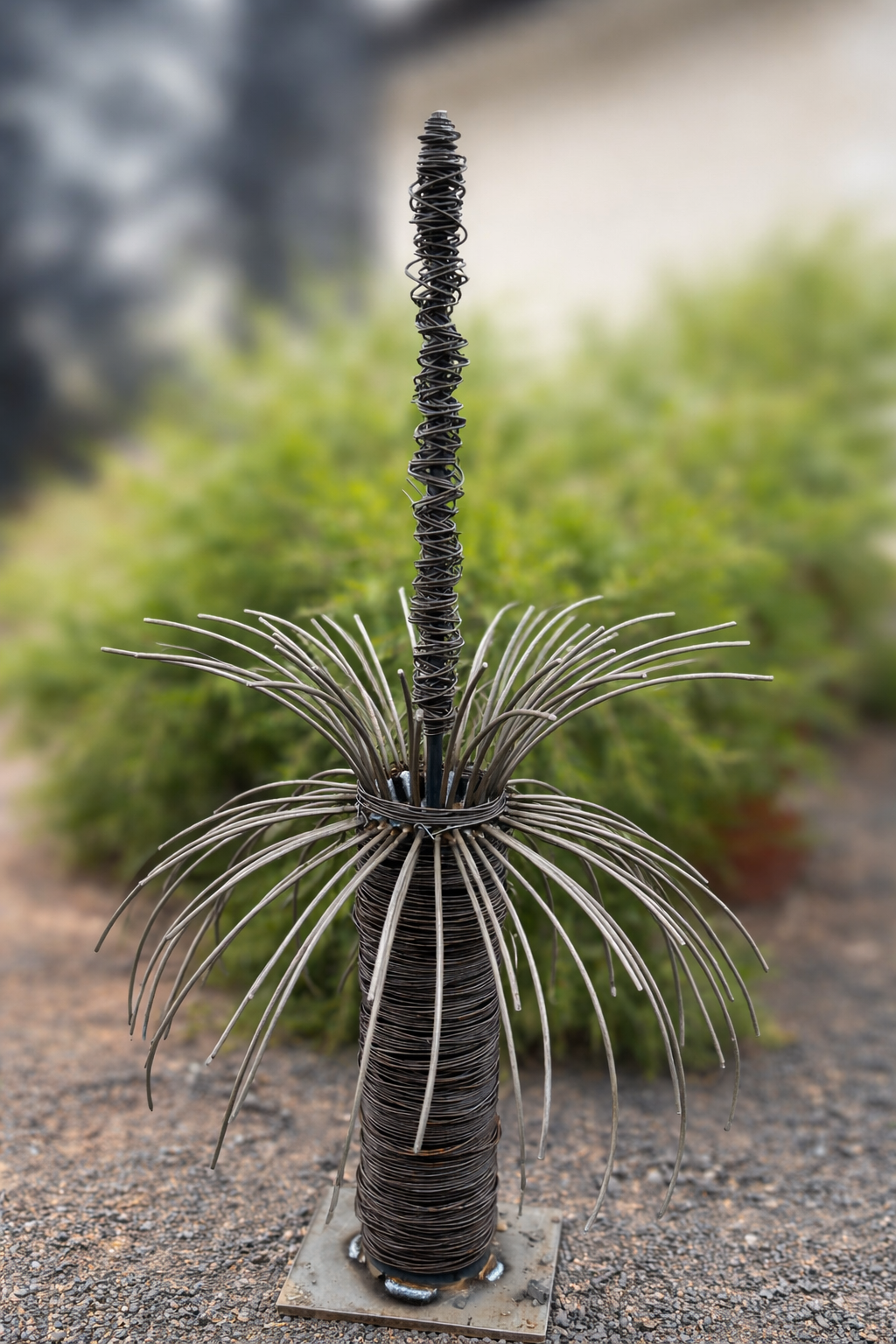 Photo of a handmade metal garden sculpture resembling a grass tree