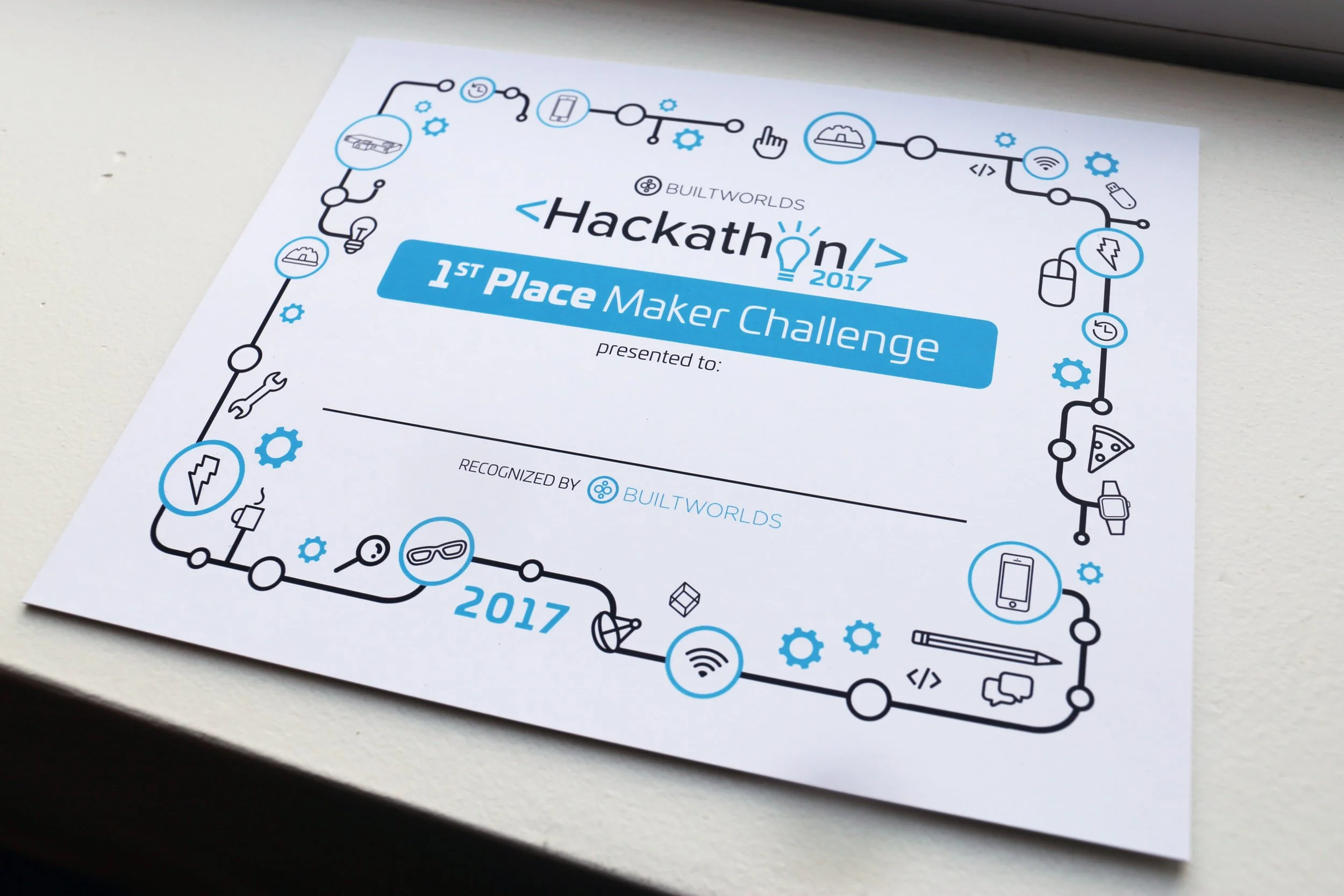Certificate for Hackathon 2017 by Builtworlds, awarded for 1st Place Maker Challenge, with technology-themed border decorations.