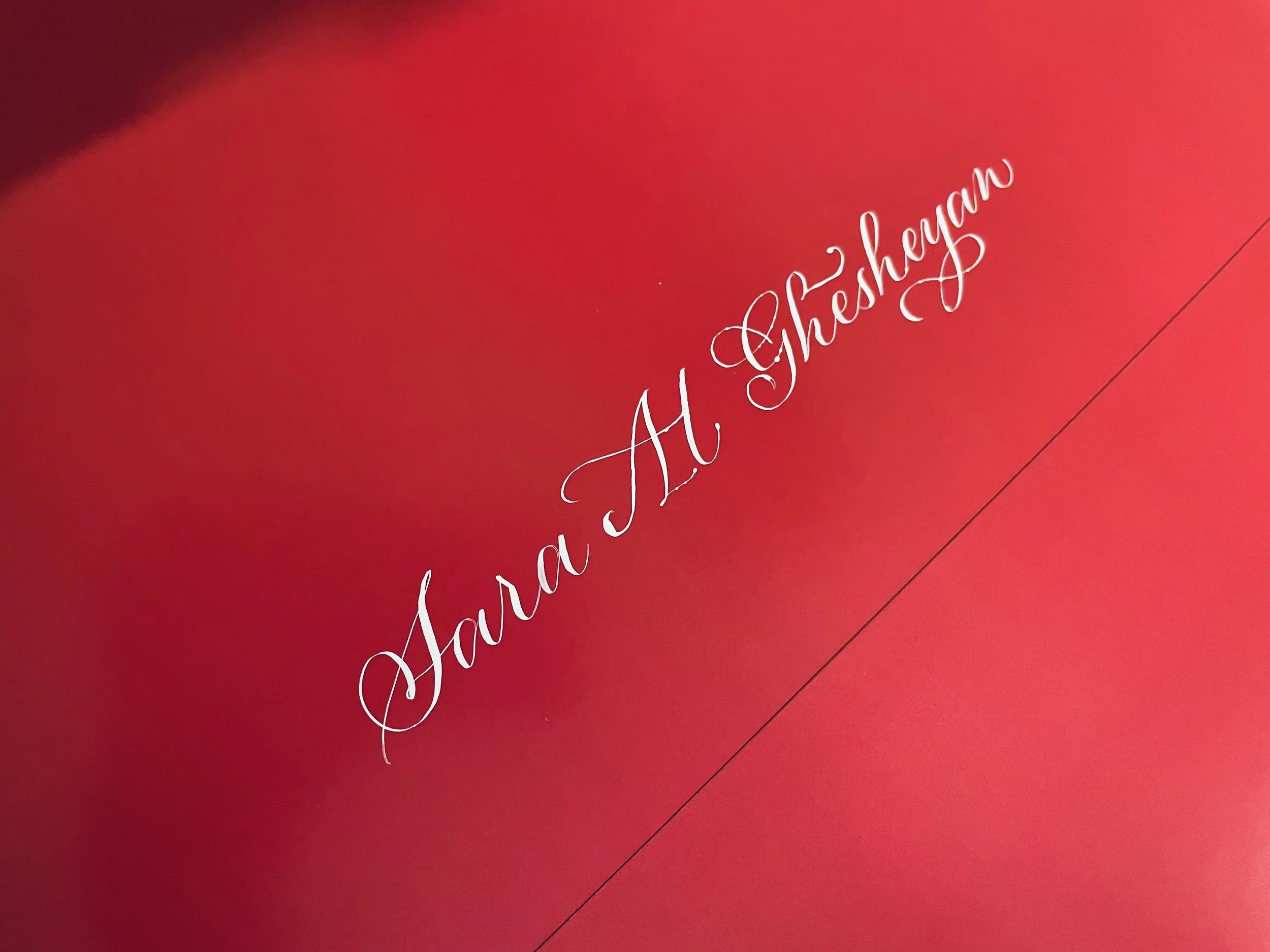 A red background with white cursive text that says "Ma Cherie".