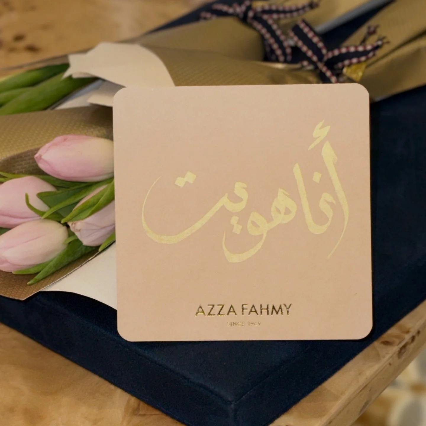 Gold foil Arabic calligraphy on an Azza Fahmy gift card