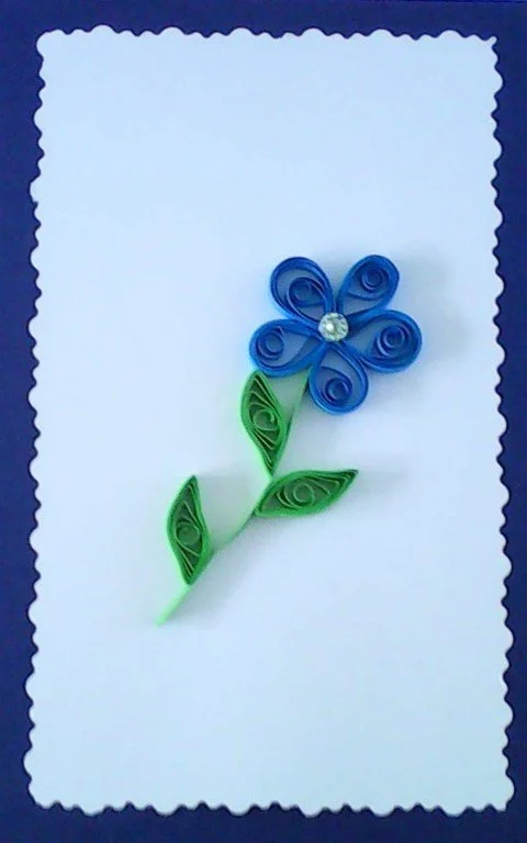 Blue flower made of curled paper
