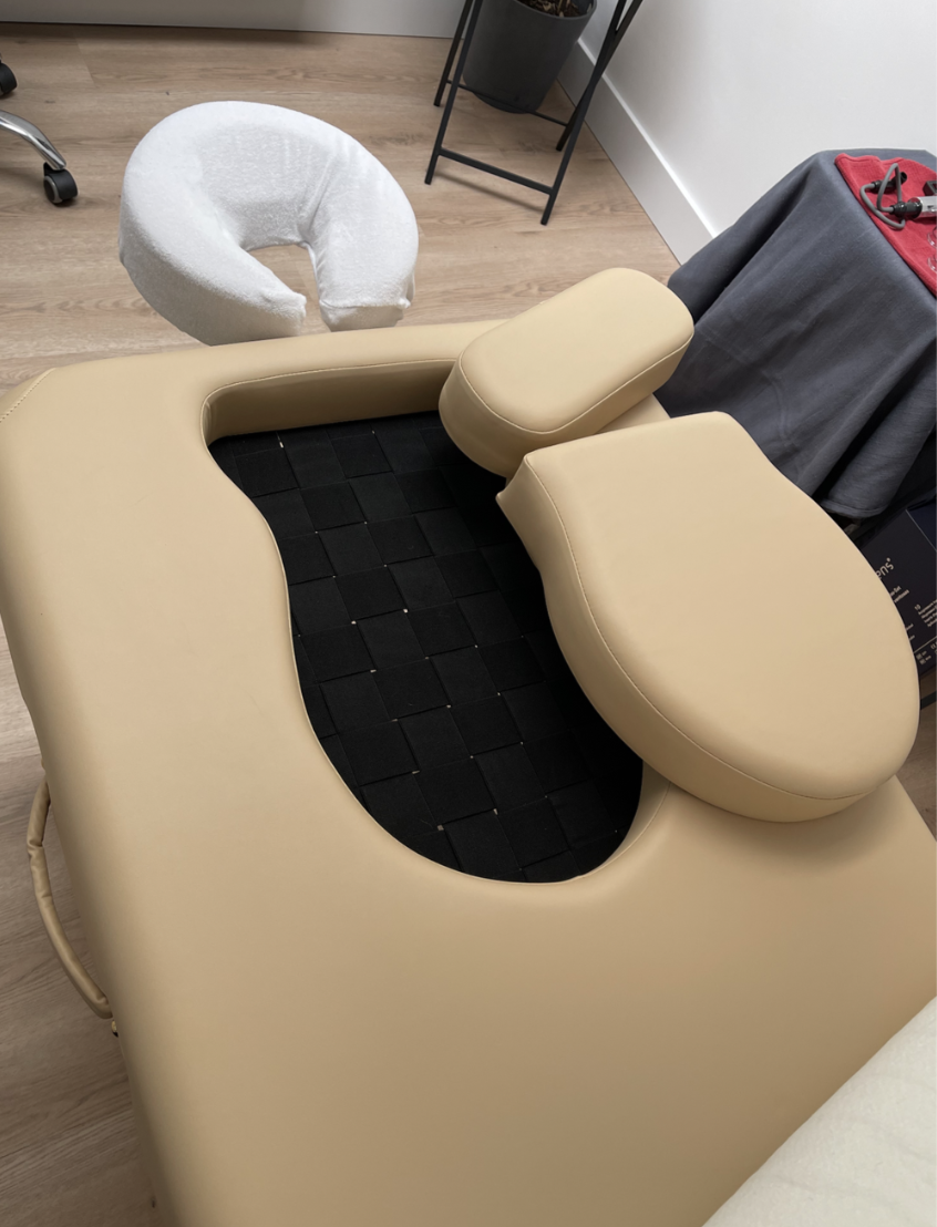 Massage table for gestating bodies
