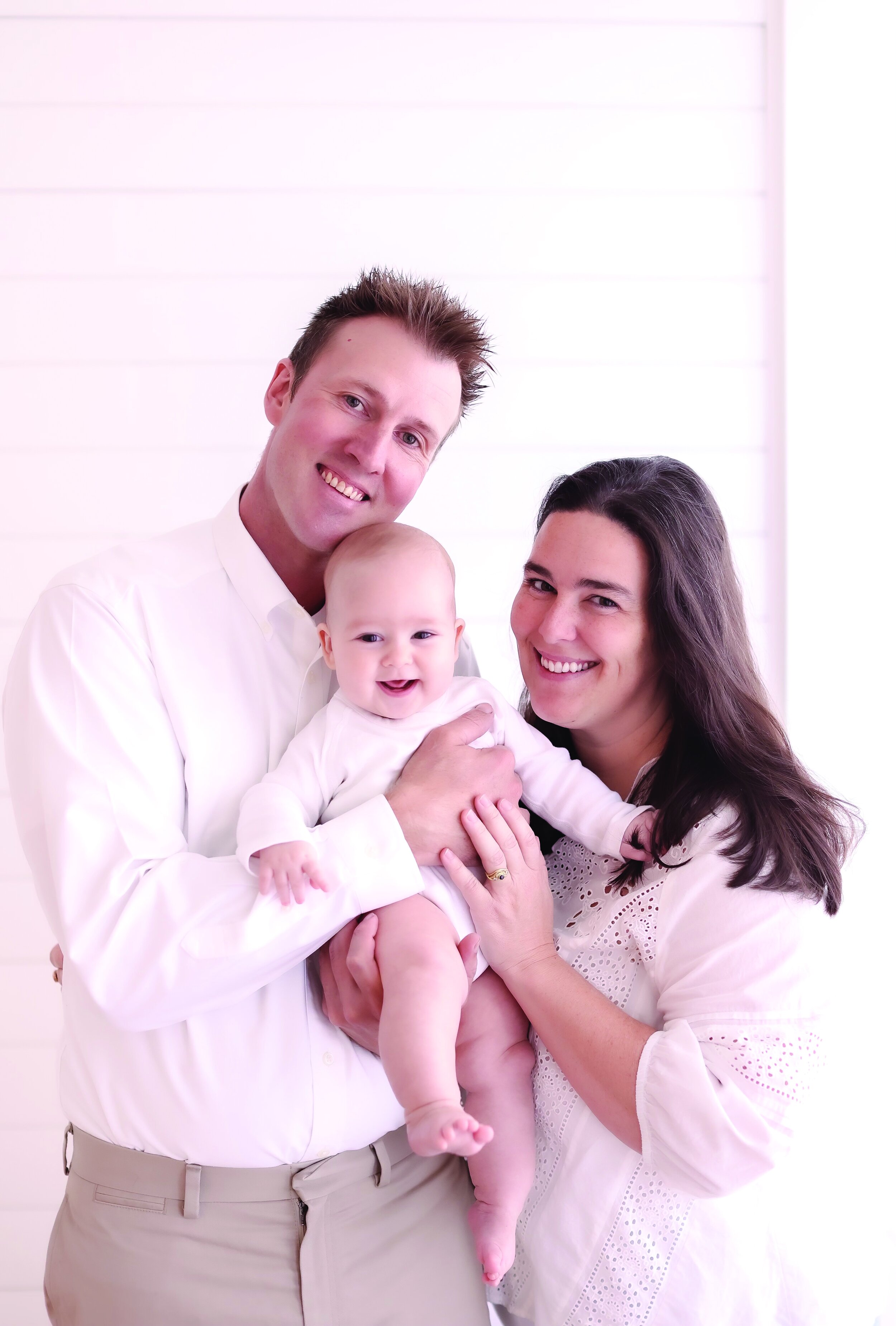 Julia Walker Thomas ’08 with her partner Adam and son Silas