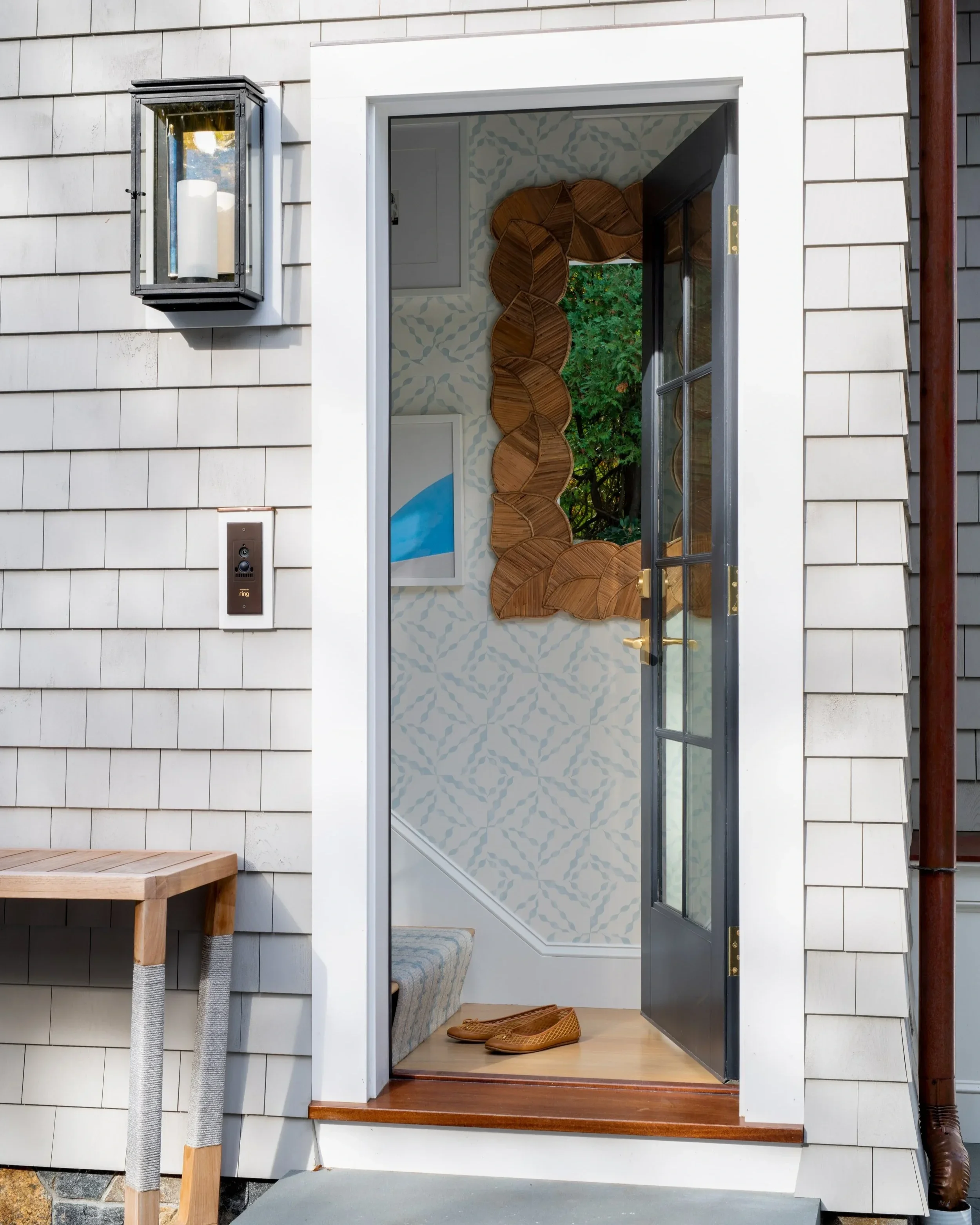 Marblehead, Massachusetts coastal home patio designed for outdoor entertaining overlooking the rocky coastline.