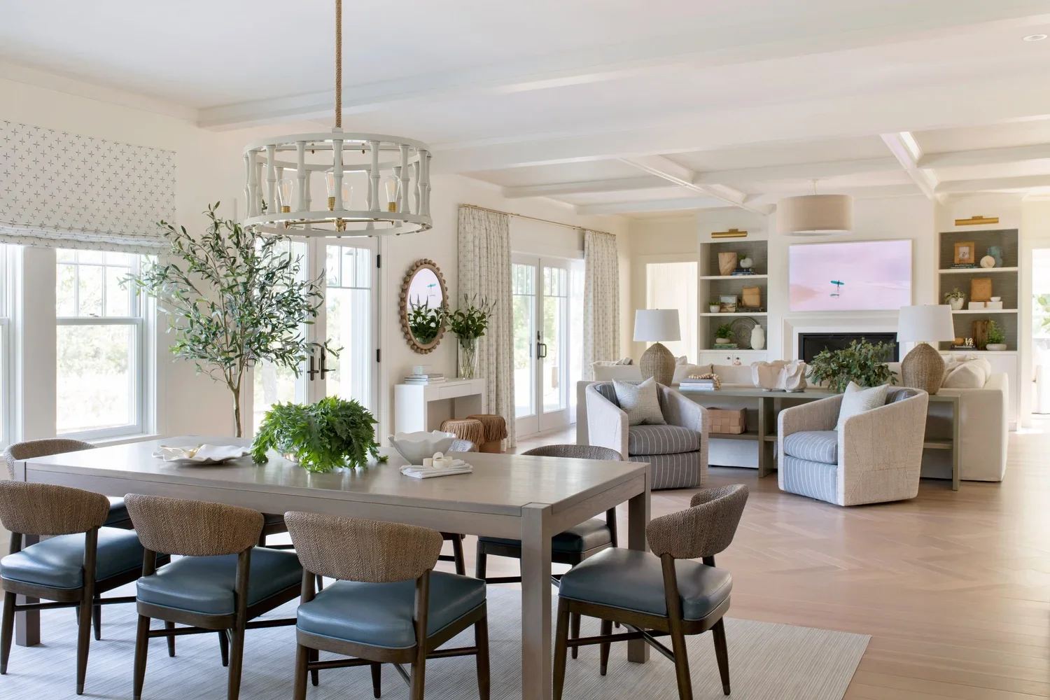 Coastal-inspired living room in a custom 5,000-square-foot new construction home featuring layered neutral furnishings, natural textures, and kid-friendly design details.