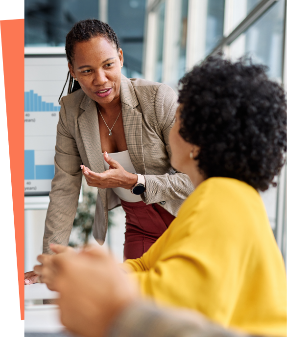 Two women talking at work