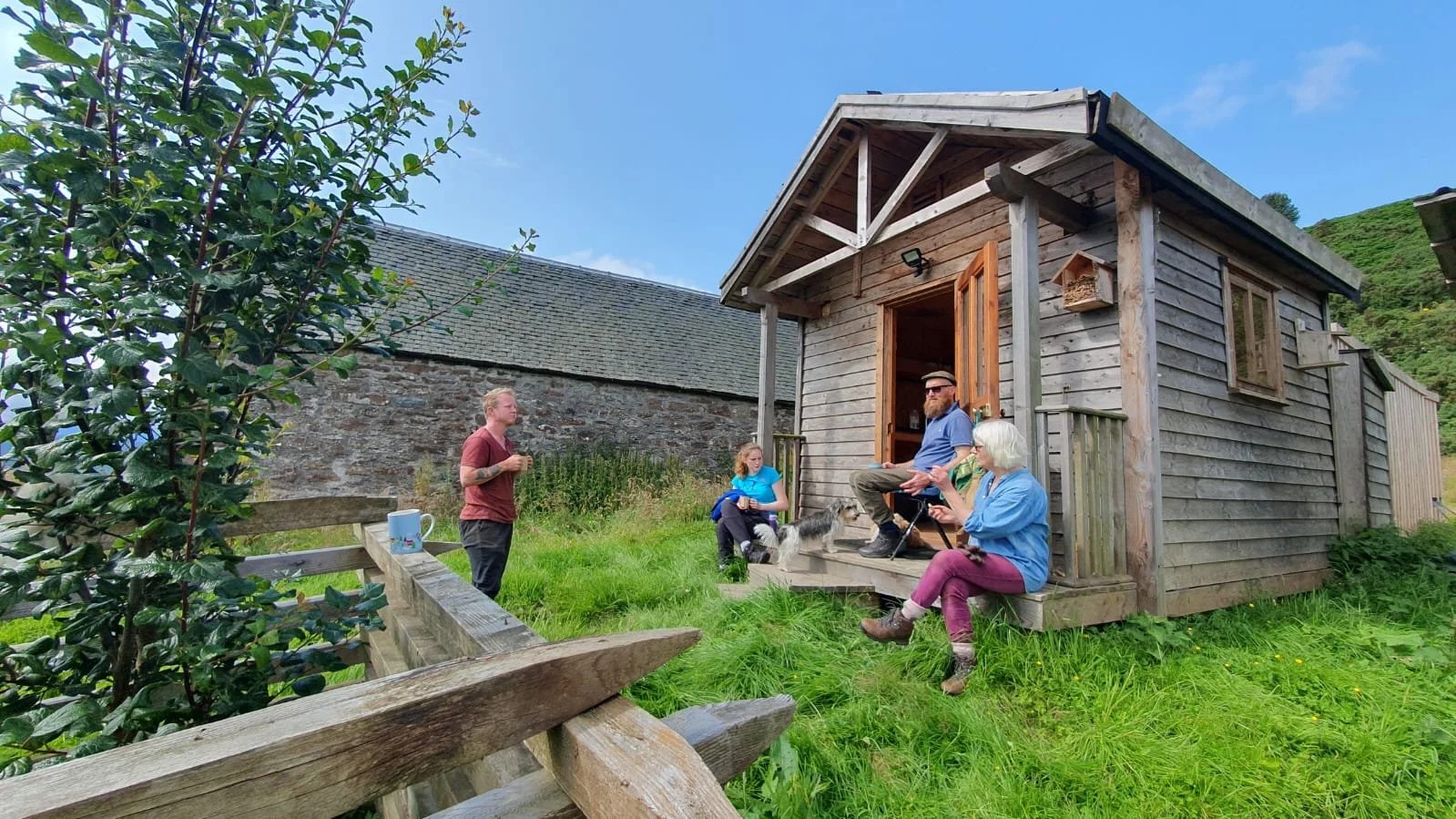15 Volunteer Nature Days tea break at hut summer 2024.jpg